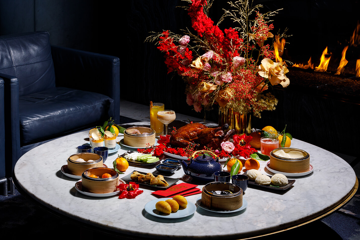 A table covered in plates with food in celebration of Lunar New Year