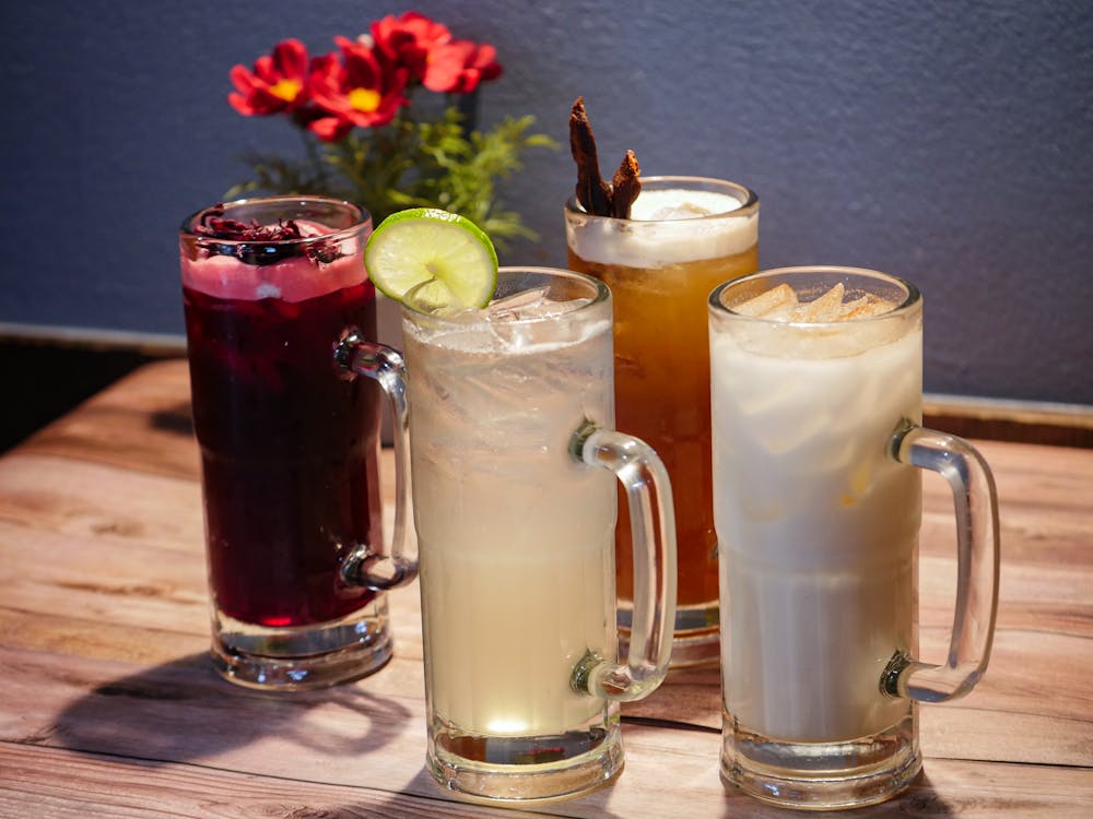 a cup of coffee and a glass of beer on a table