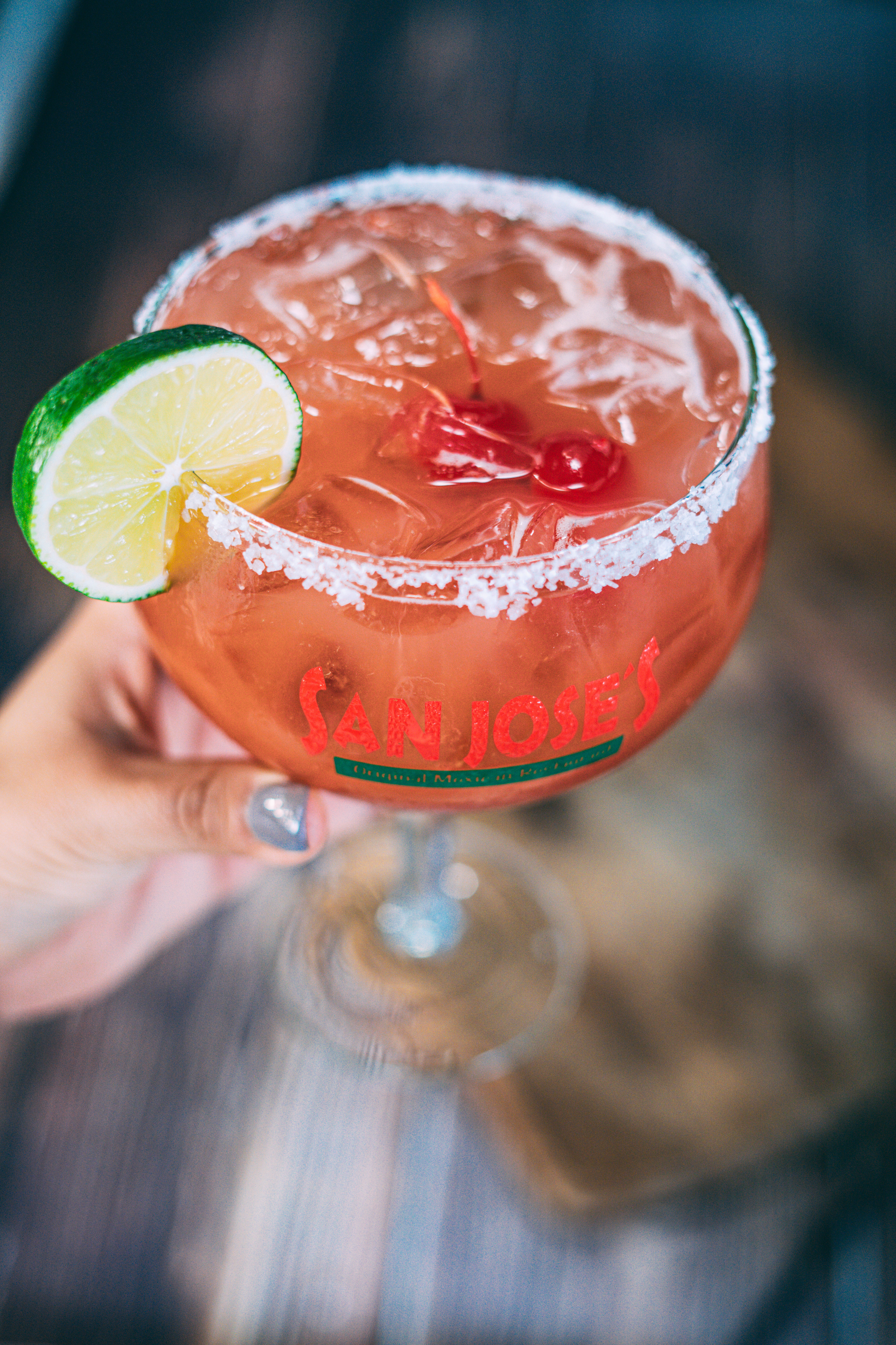 a close up of a glass of orange juice