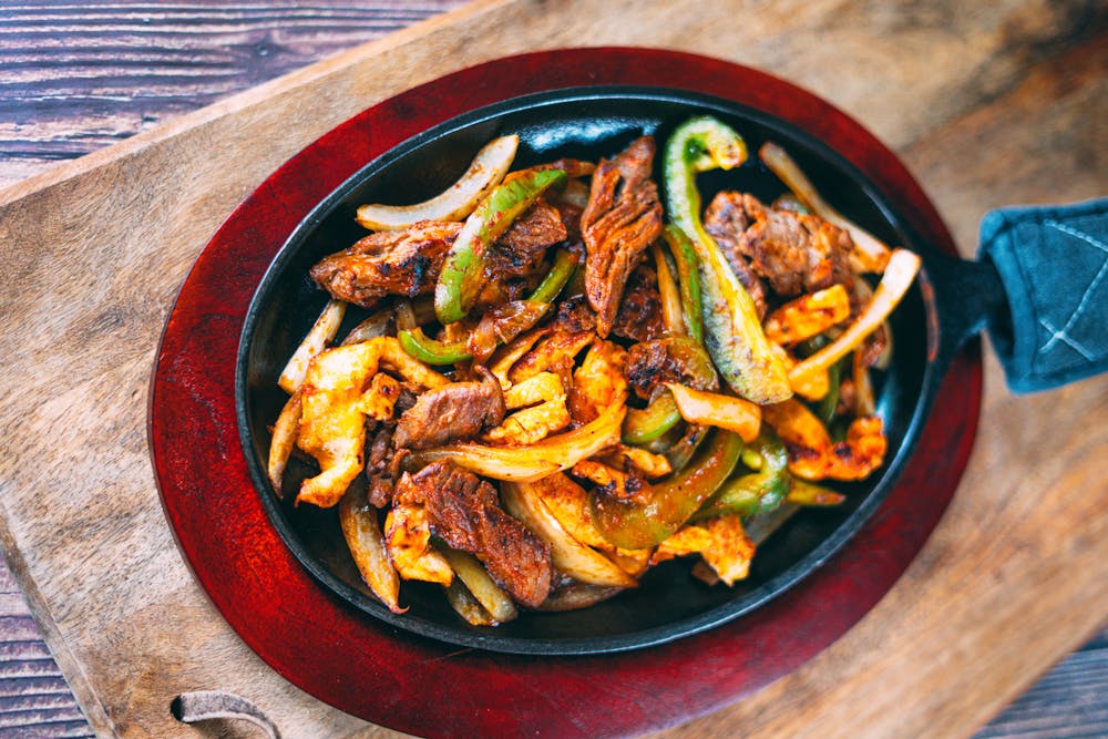 a plate of food on a wooden table