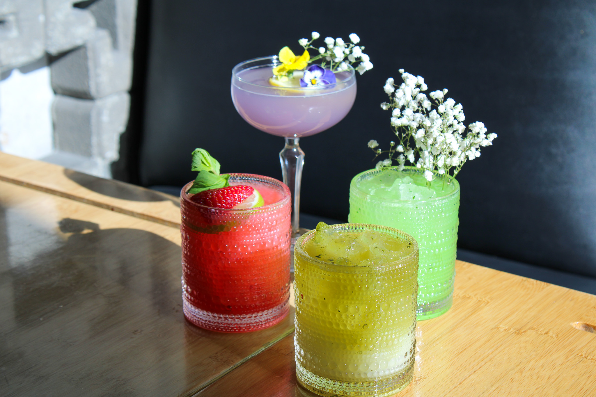 a glass vase sitting on top of a wooden table