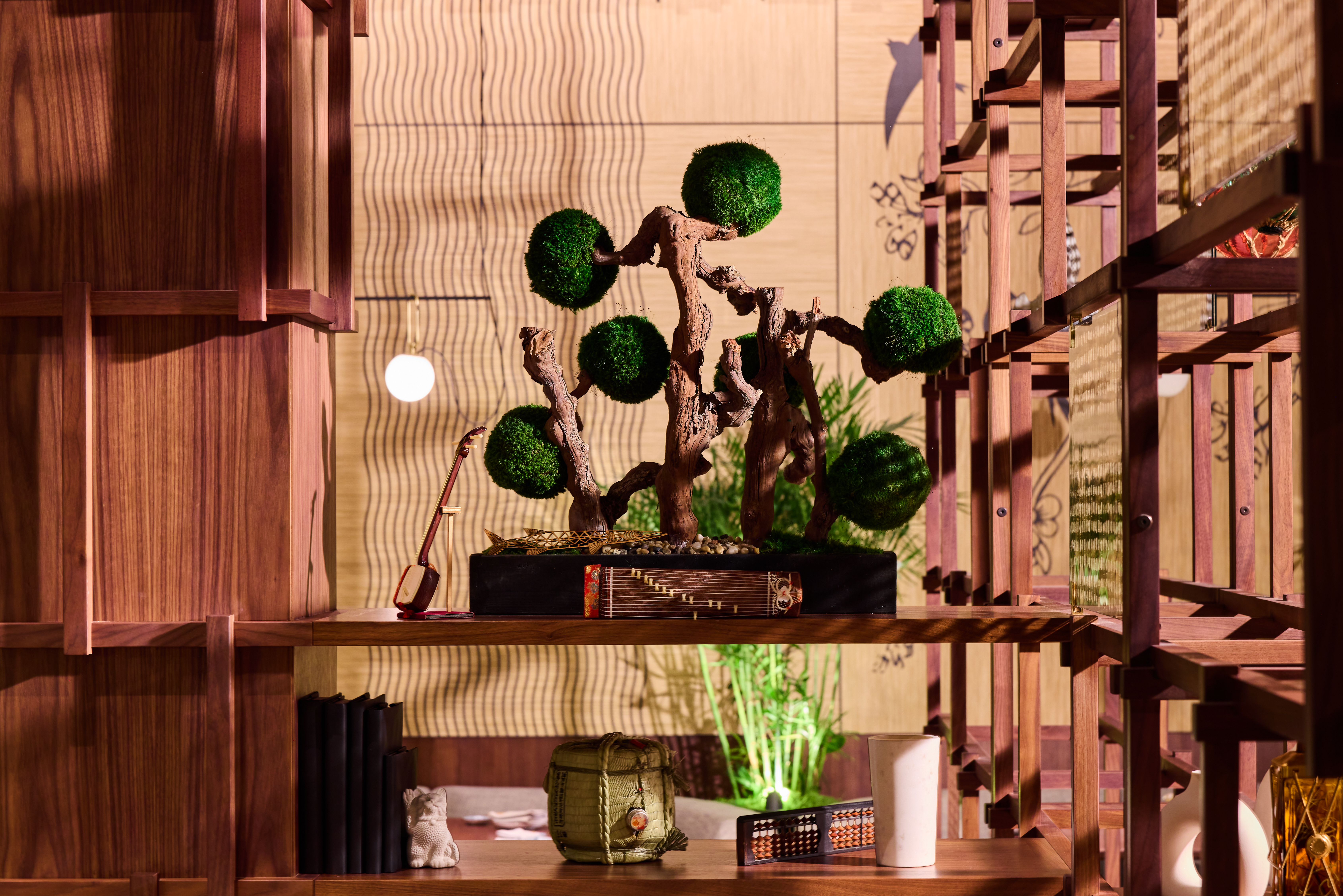a vase of flowers sitting on top of a wooden table
