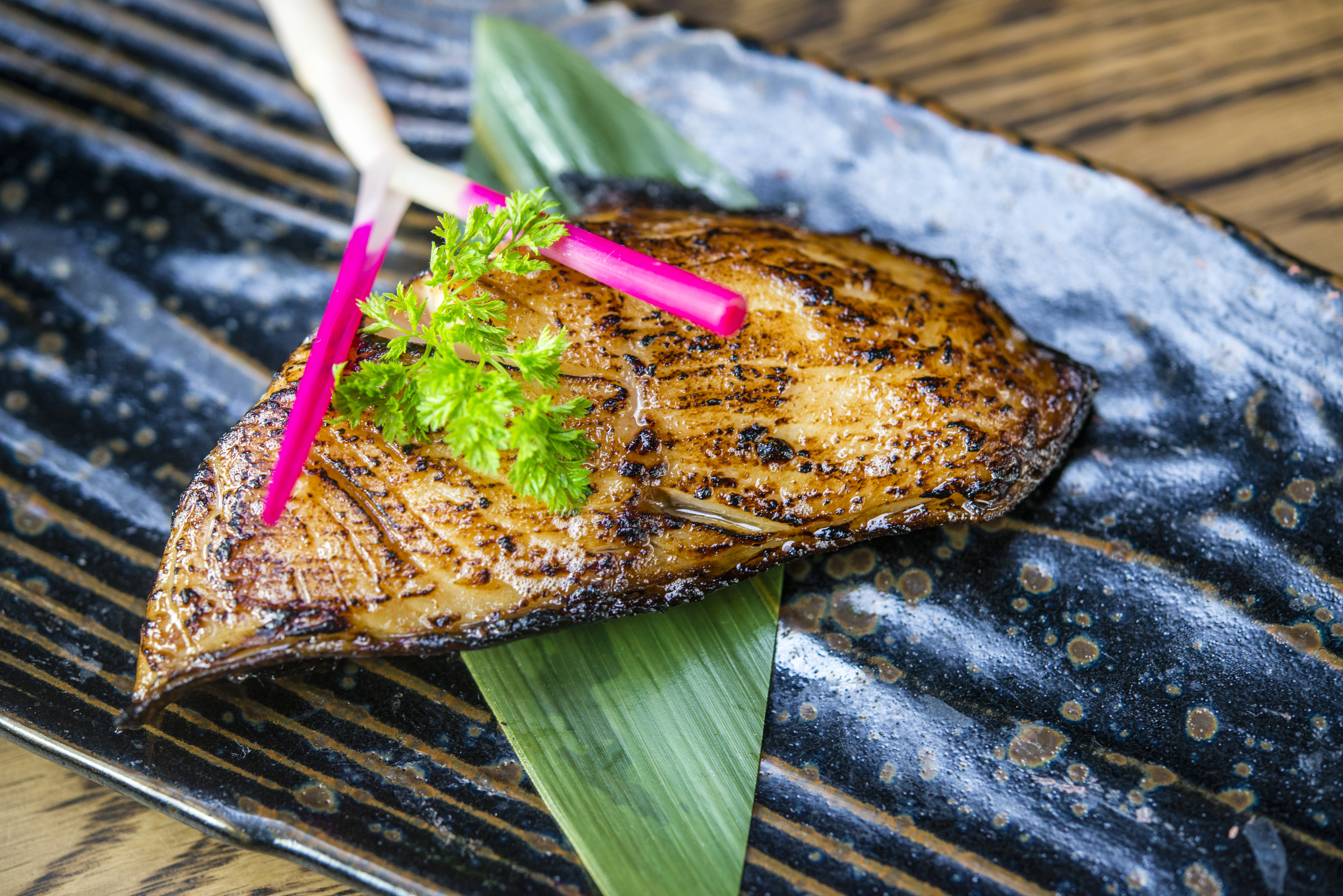 a close up of a piece of cake with a knife and fork