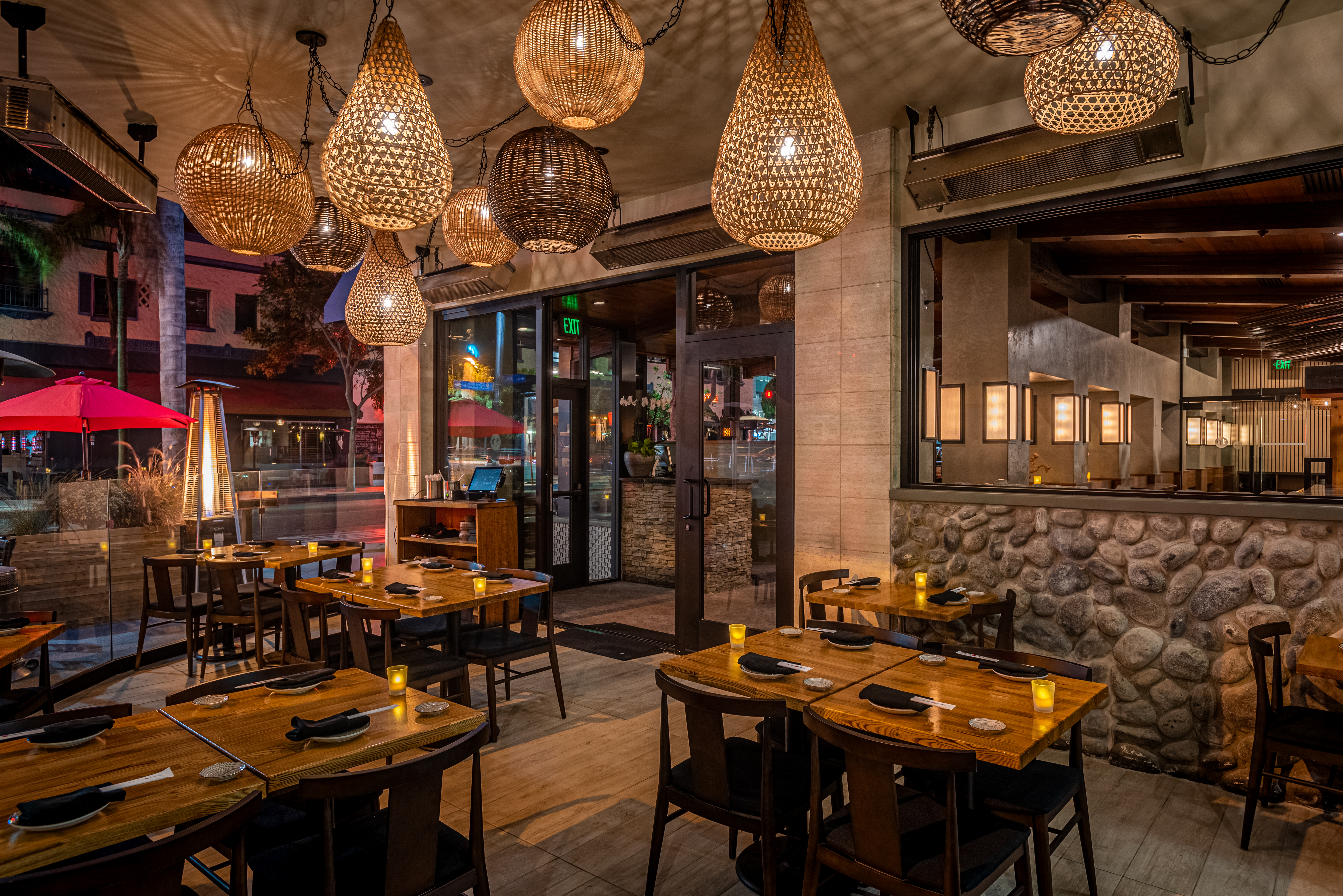 a group of people sitting at a table in a restaurant