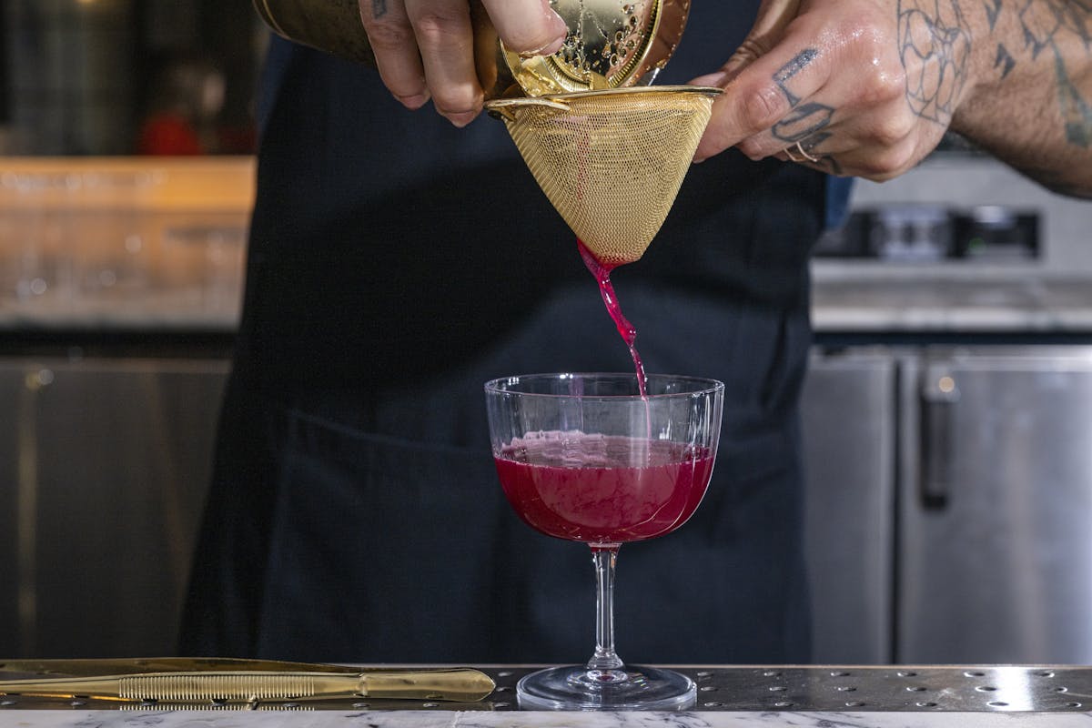 a person holding a glass of wine