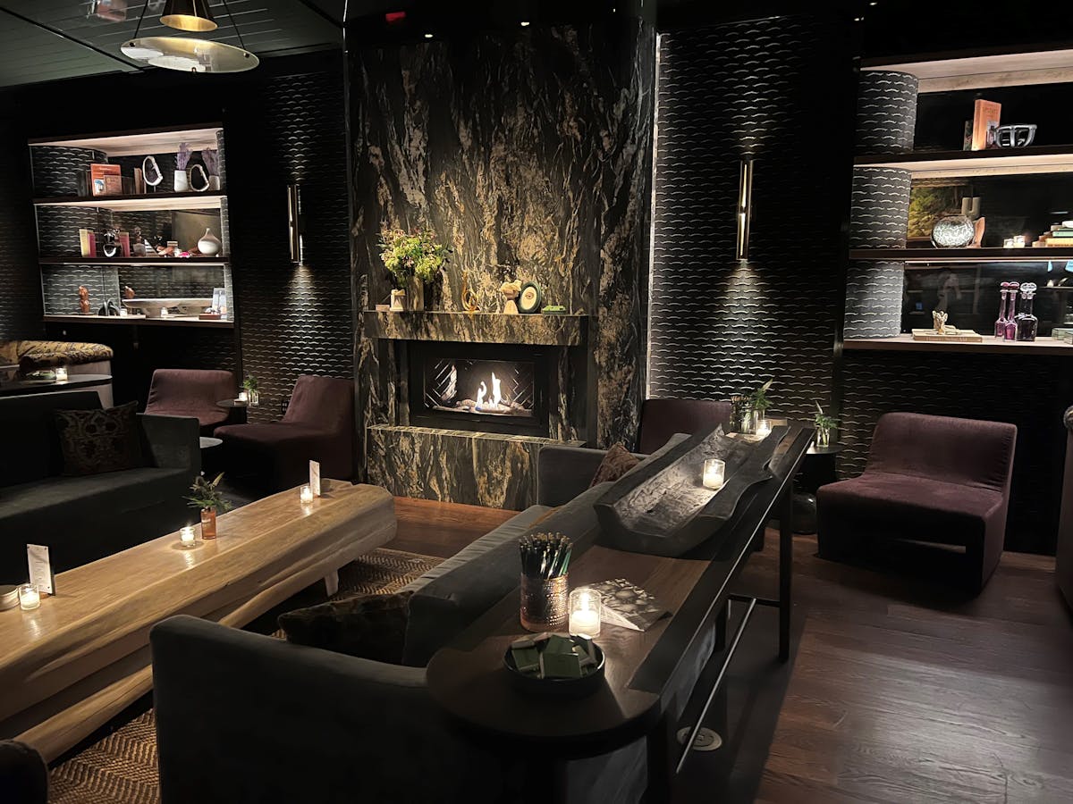 a living room filled with furniture and a fire place, cocktail bar, lunch, dinner, midtown, Hudson yards, nyc, private dining, restaurant