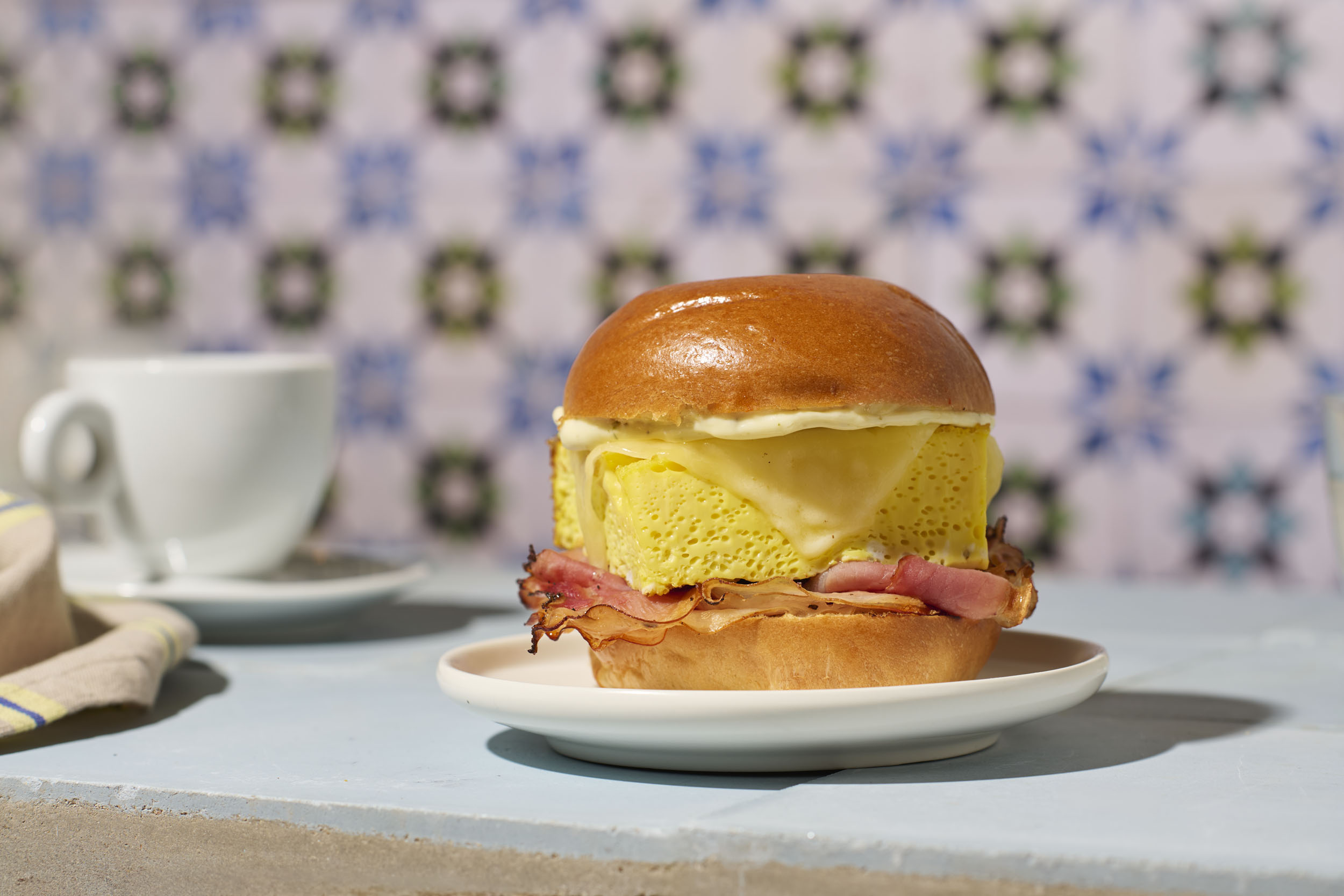 a breakfast sandwich on a plate