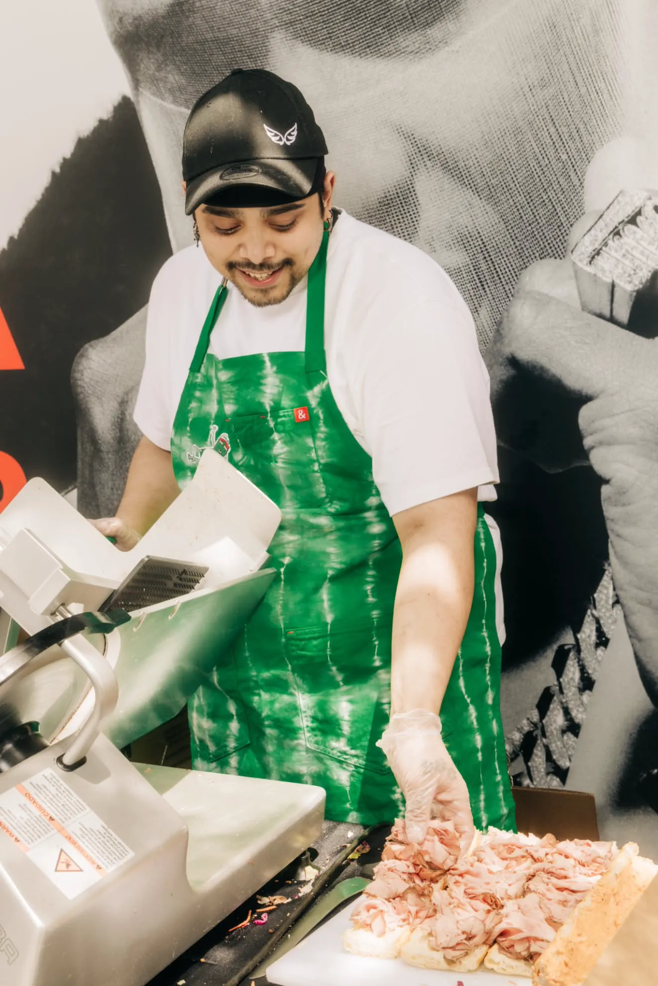 a man in a green apron