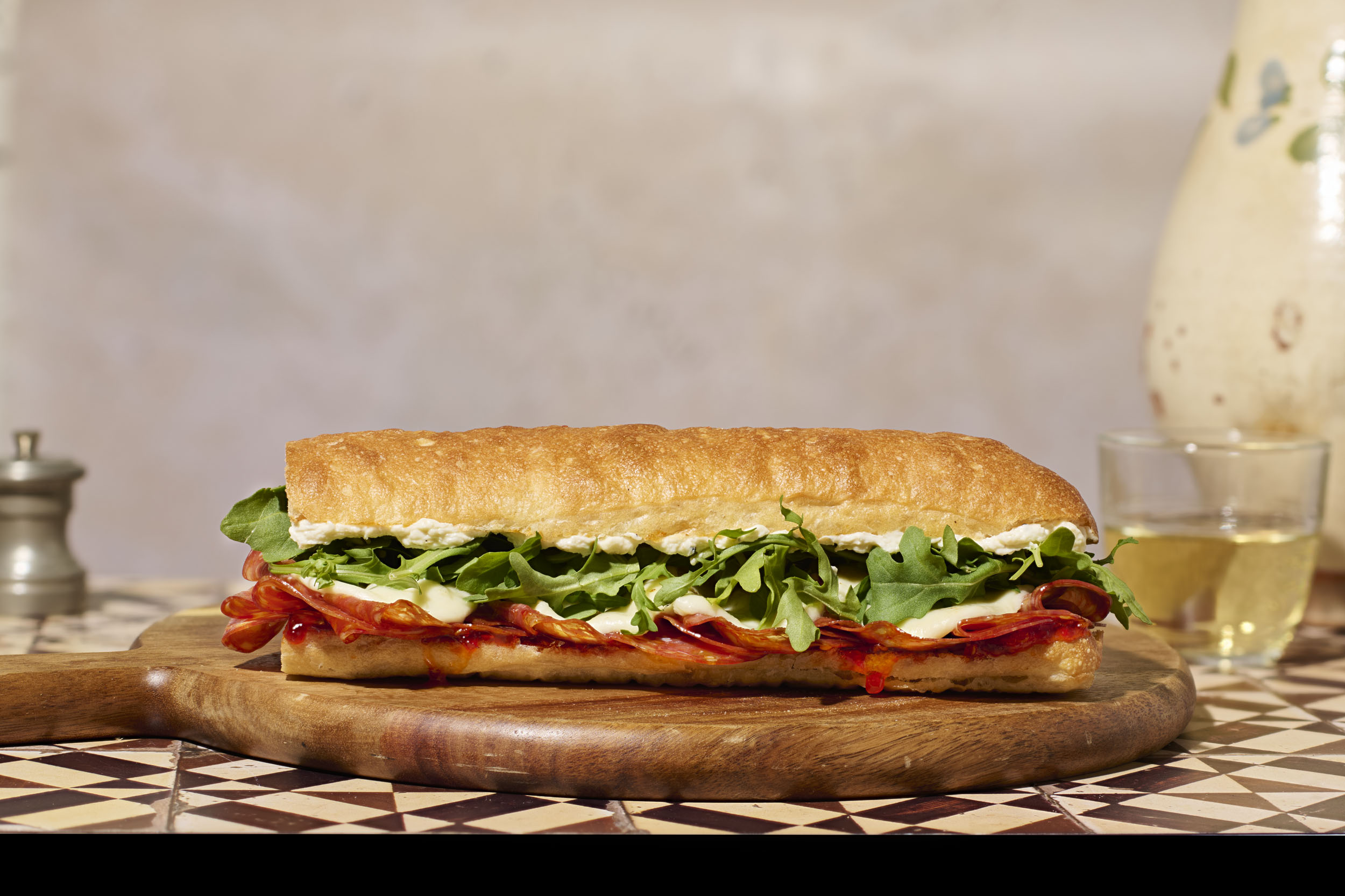 a sandwich on a wooden board