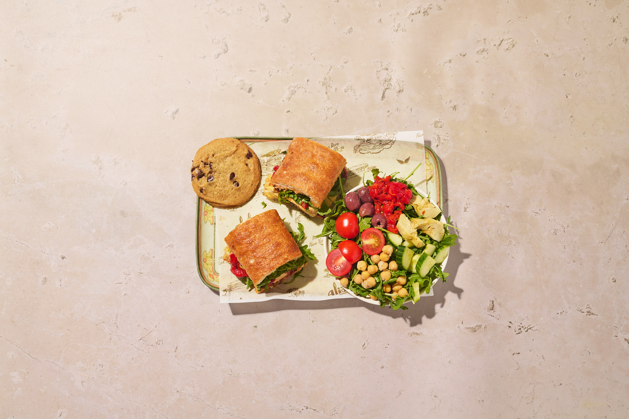 a plate of food on a marble surface