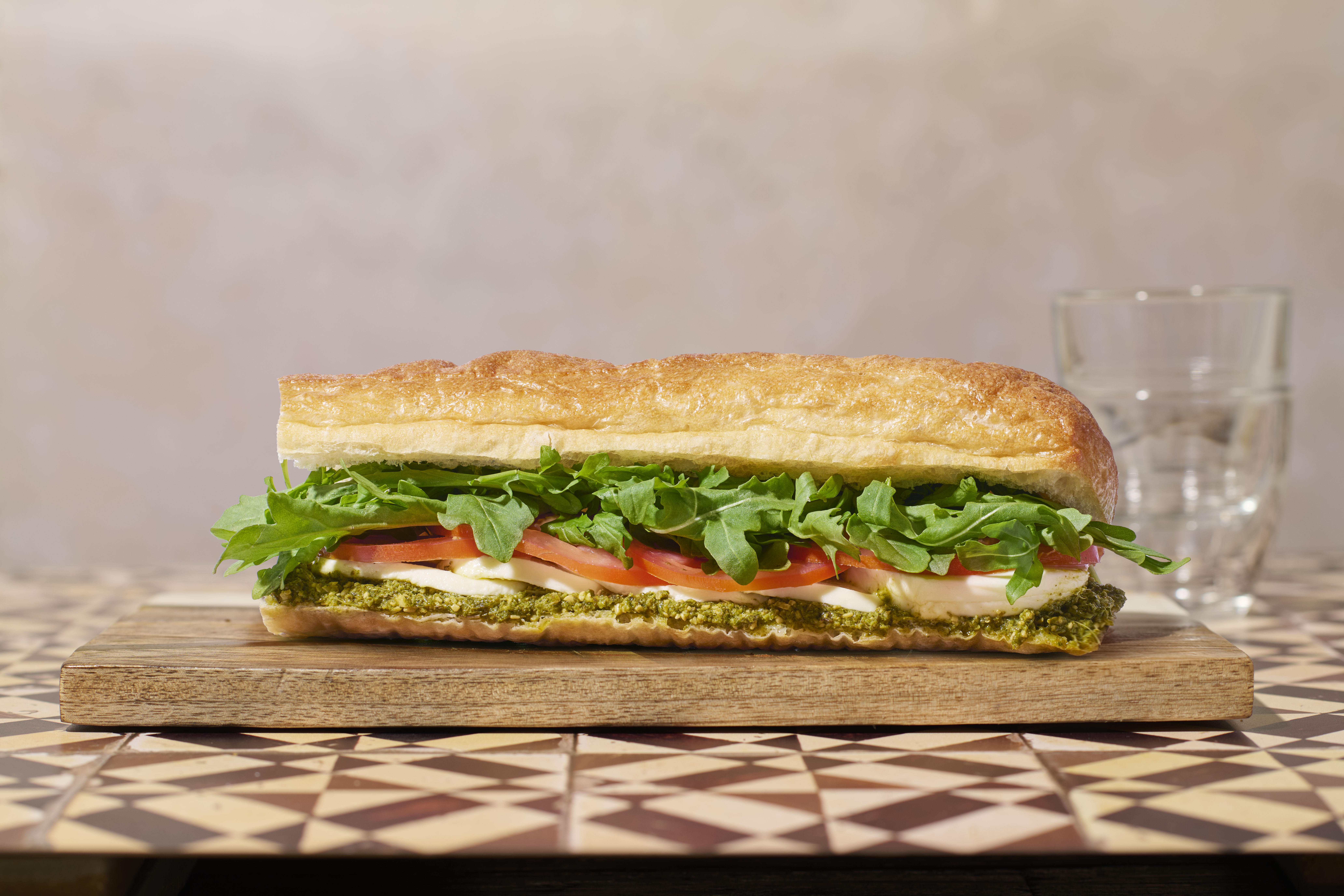 a sandwich on a cutting board