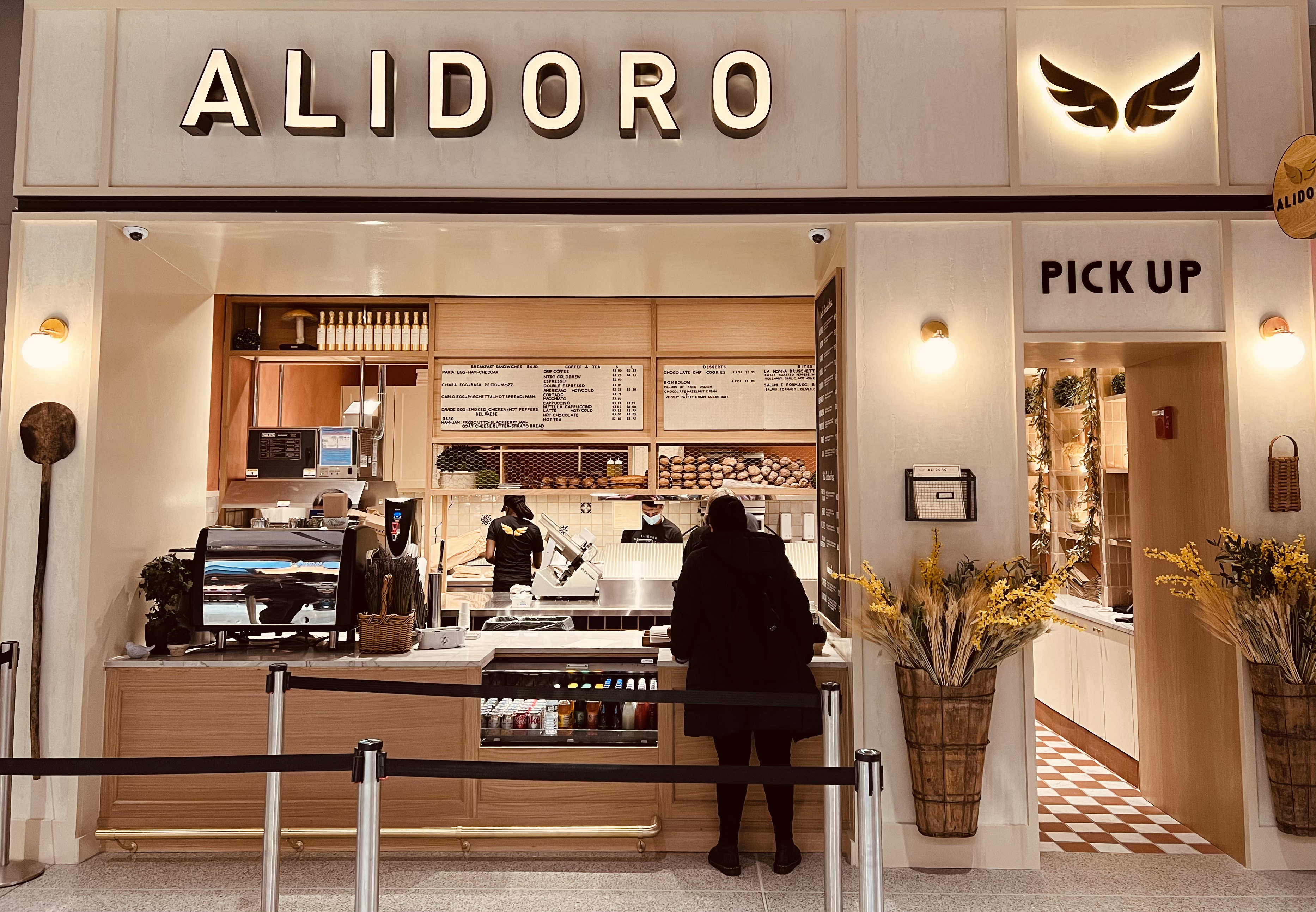 a person standing at a counter in a store
