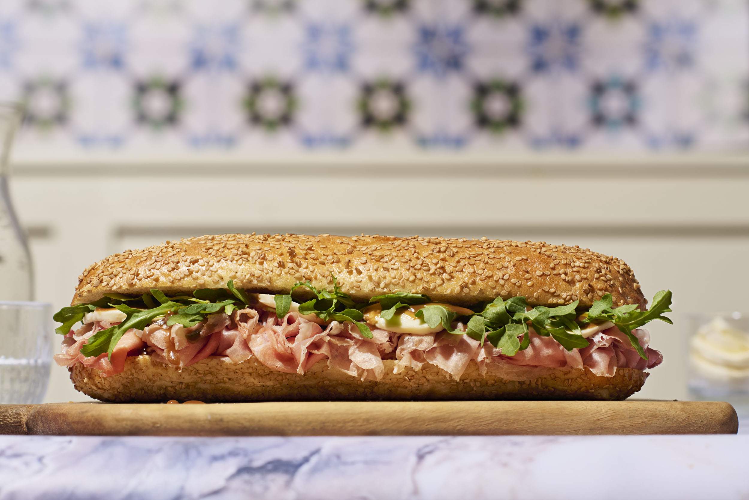 a sandwich on a wooden board