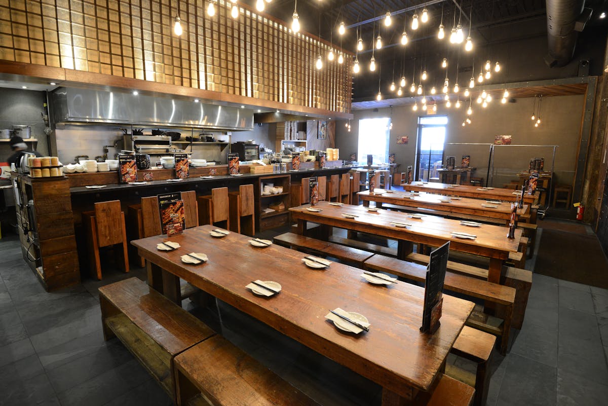 a kitchen with a table in a restaurant