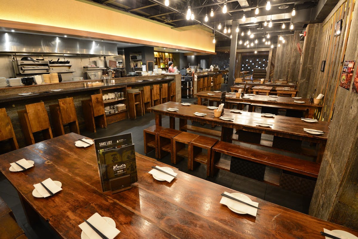 a kitchen with a table in a restaurant