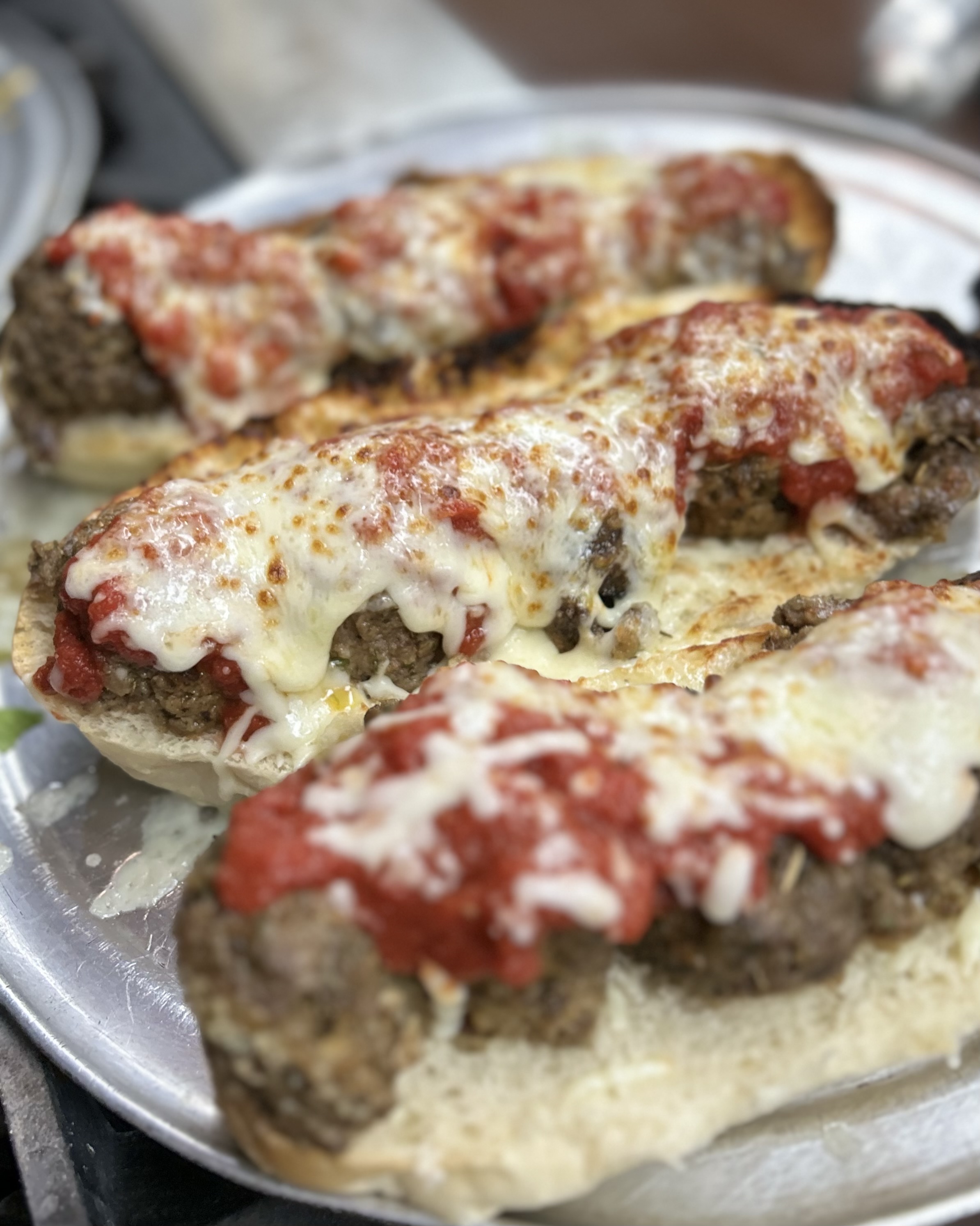 a close up of a plate of food with a slice of pizza