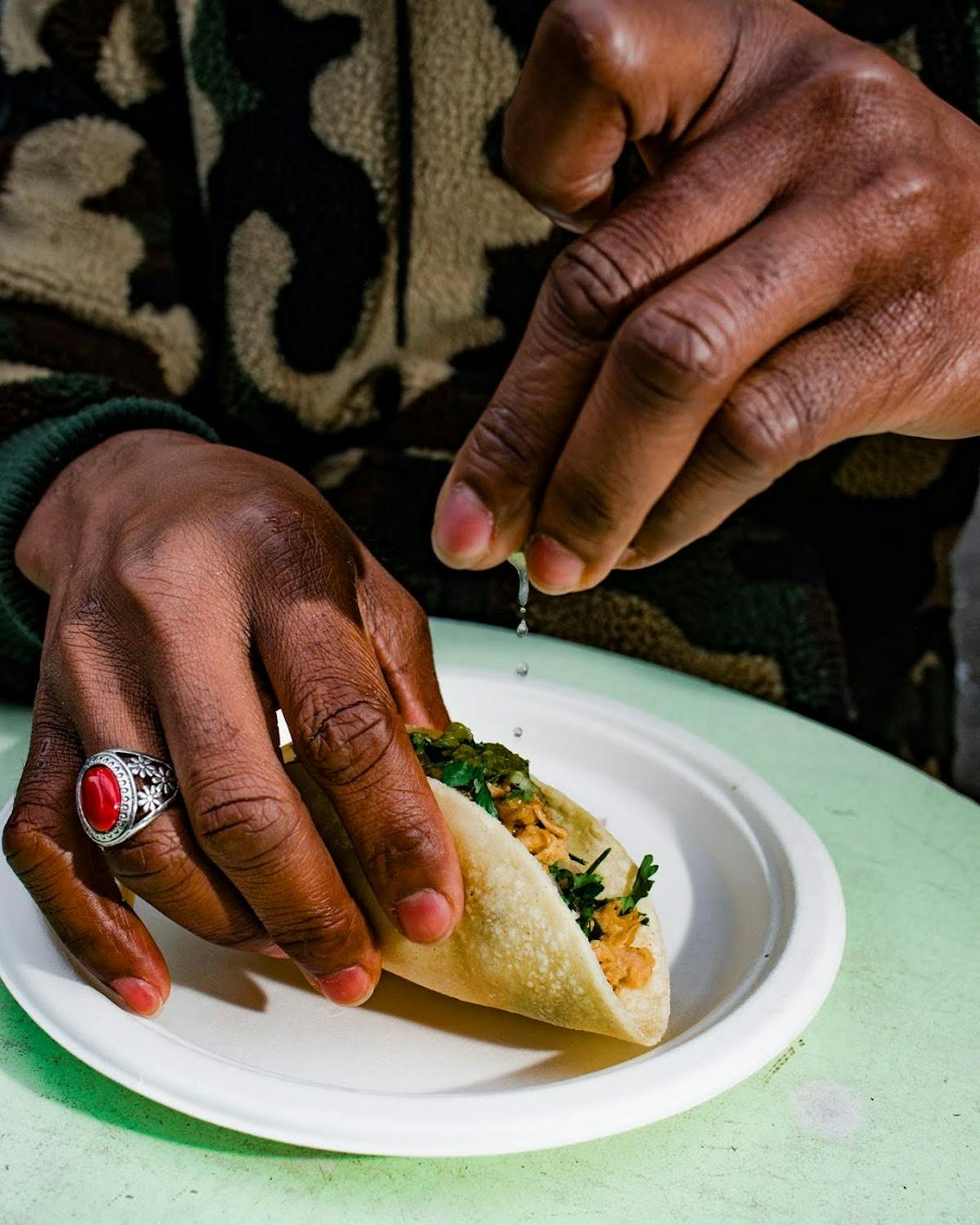 a person holding a plate of food