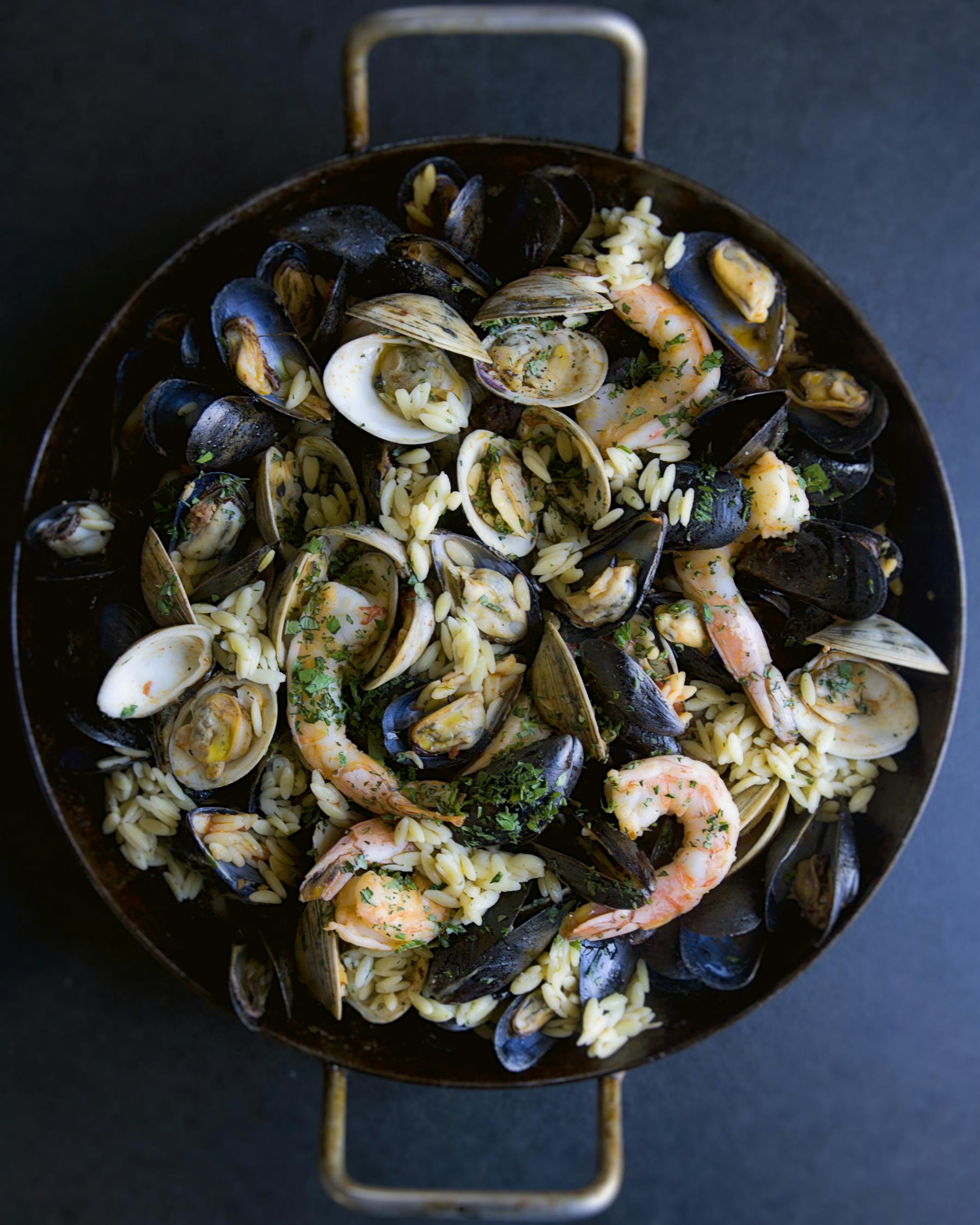 a close up of a plate filled with oysters