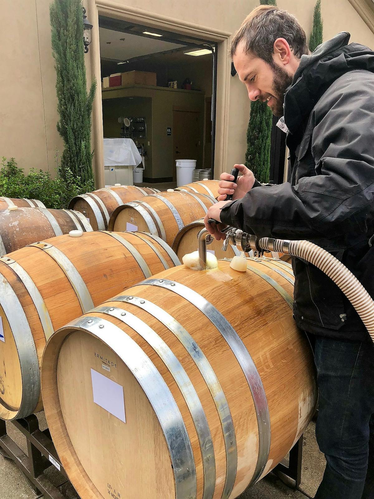 Filling up the wine barrels at DANCIN Vineyards