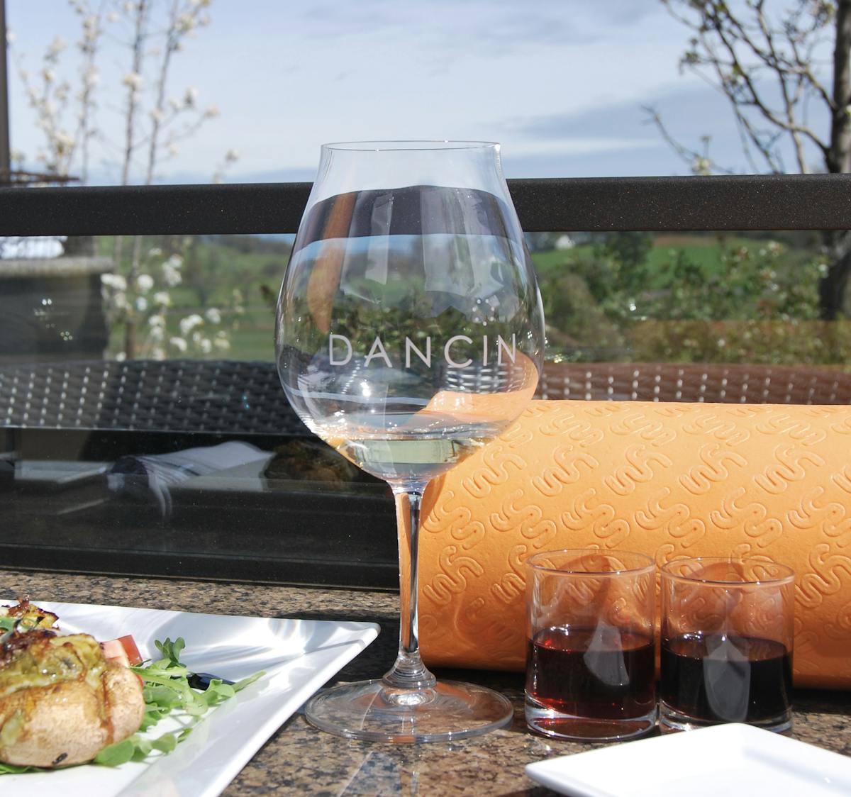 a glass of wine on a table