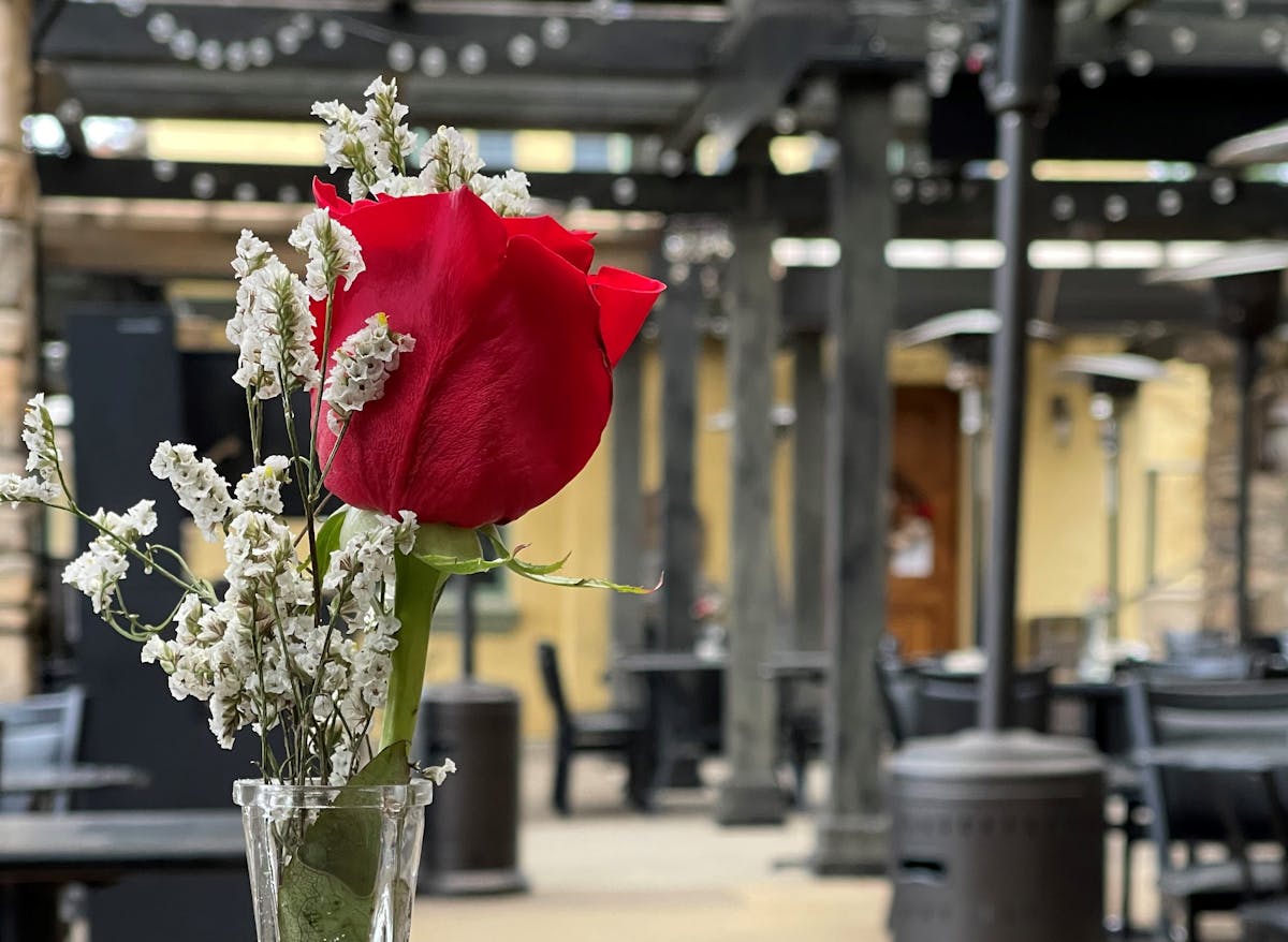 a vase filled with flowers sitting on a table