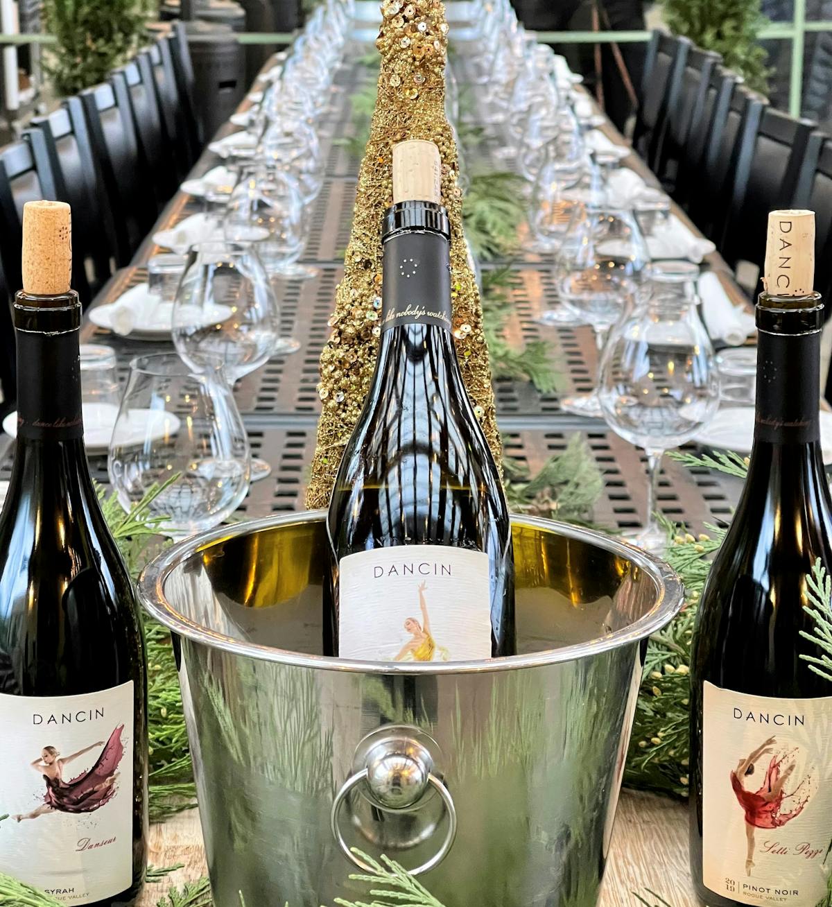 Rogue Valley Events at DANCIN with a glass of wine