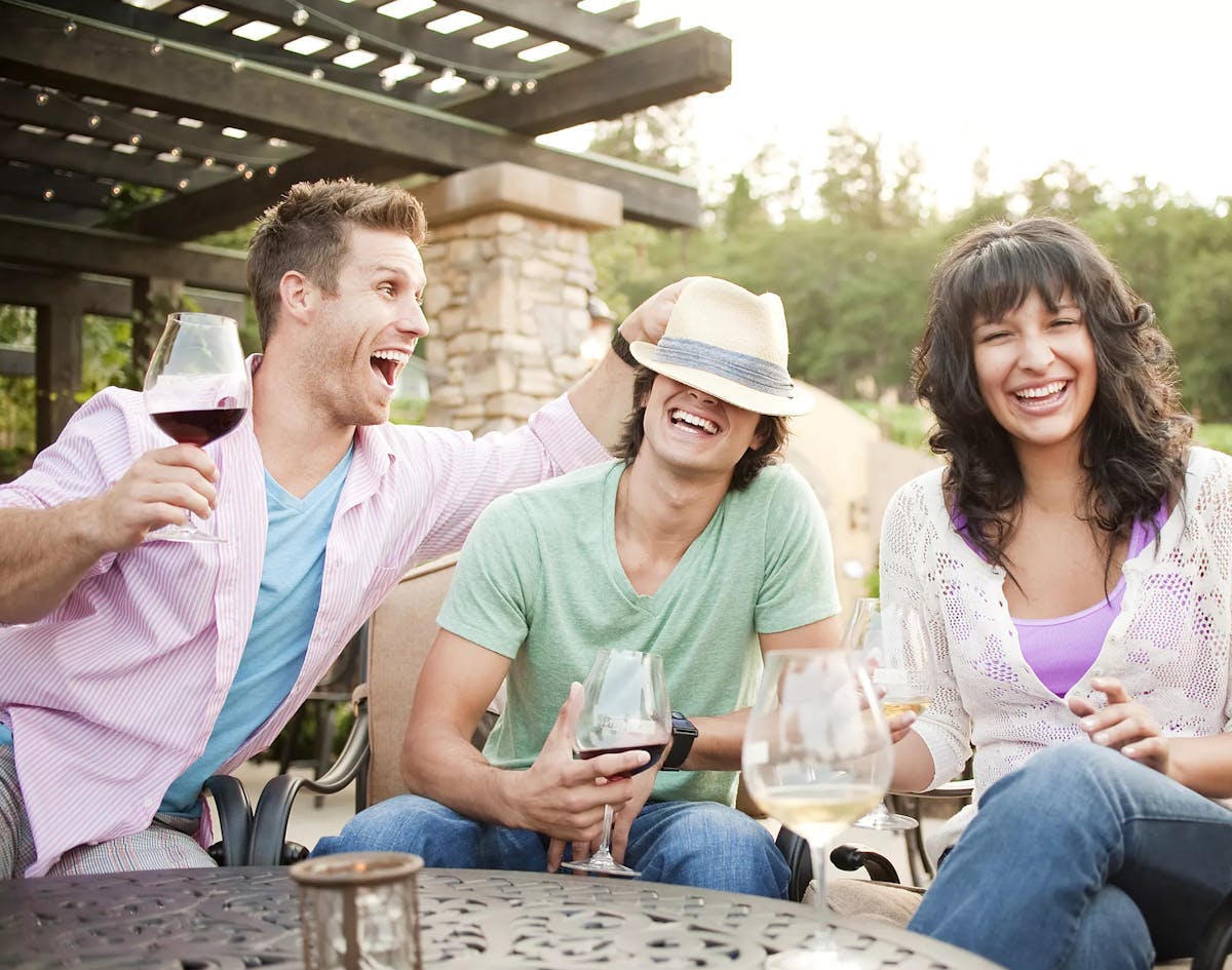 a group of people sitting on a bench
