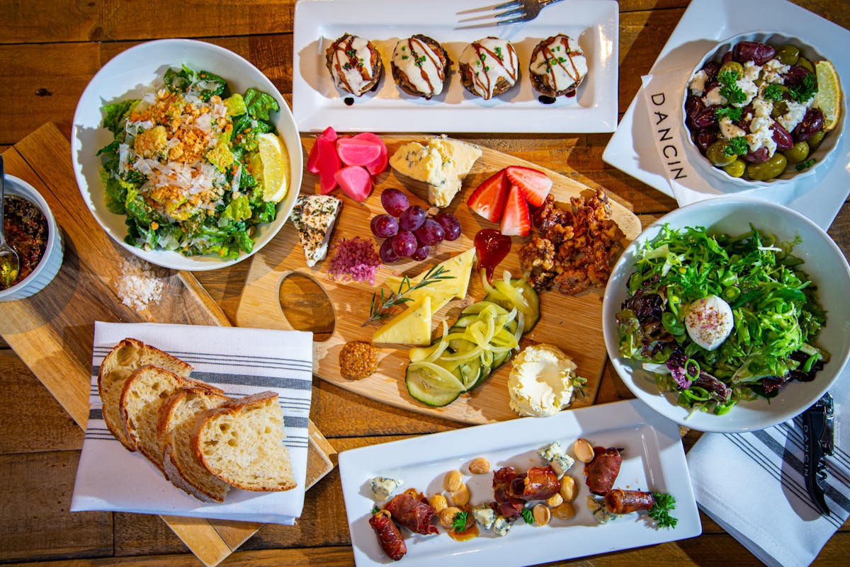 a bunch of different types of food on a table