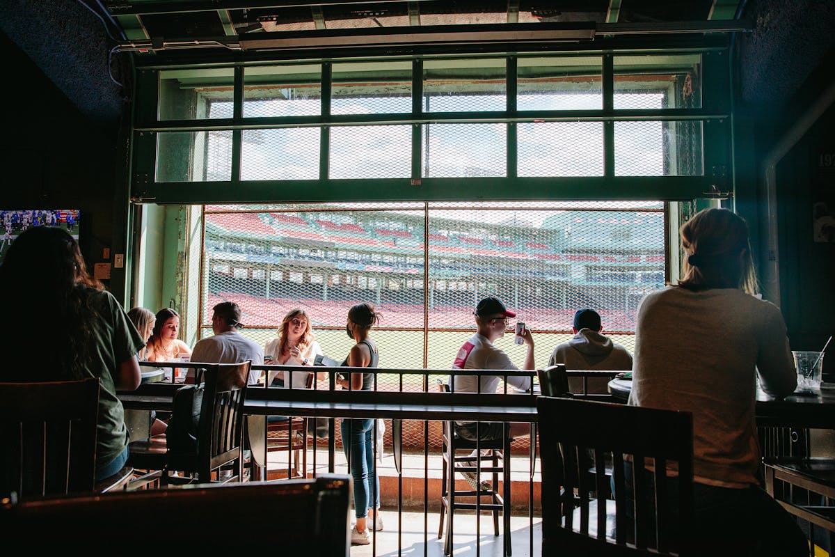 a group of people sitting at a table in a restaurant