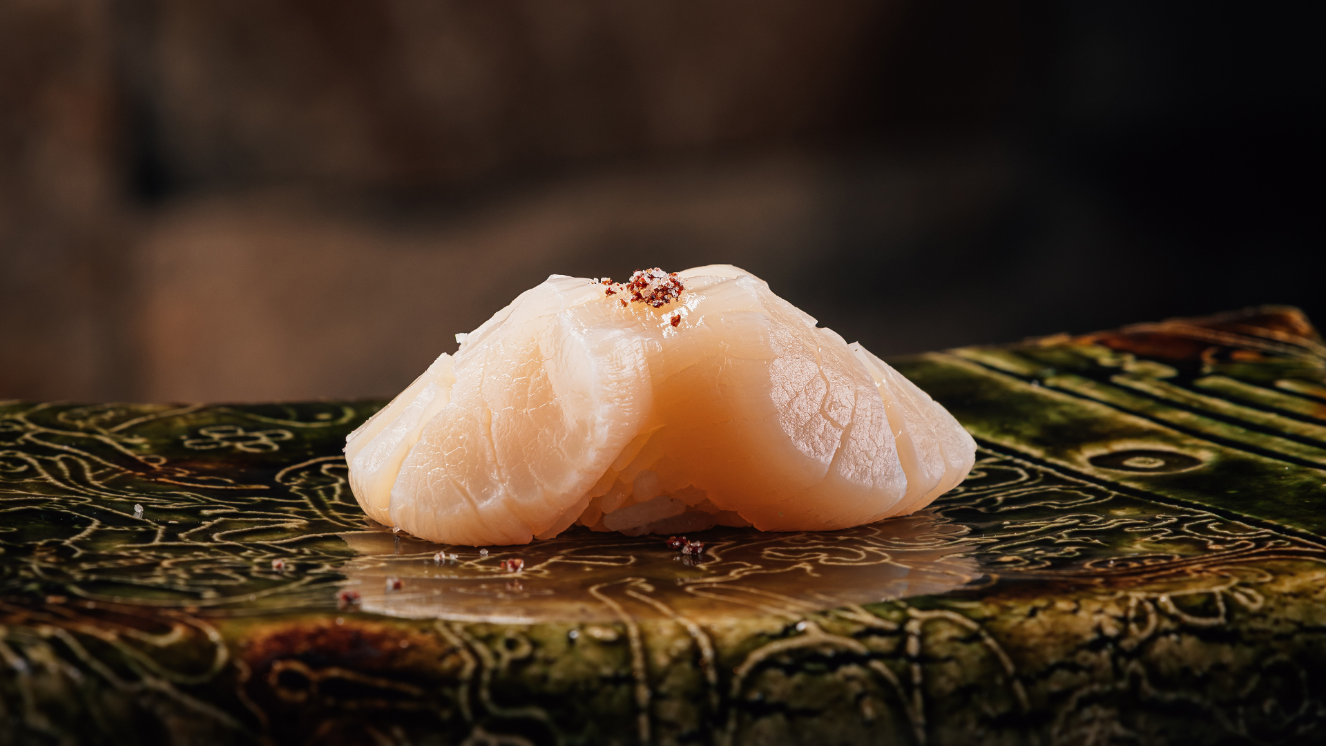 a piece of raw fish on a plate