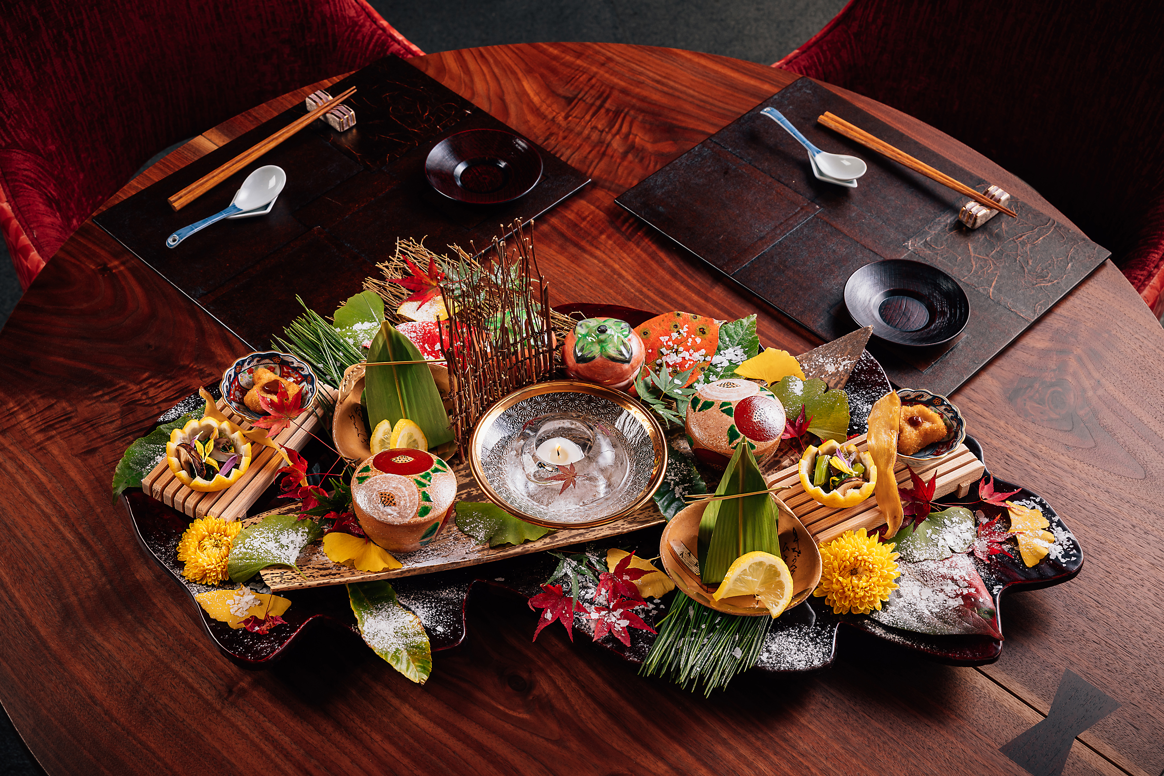 a group of stuffed animals sitting on top of a wooden table