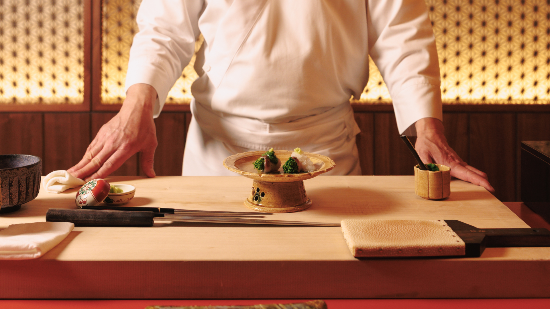 a chef preparing food on a table
