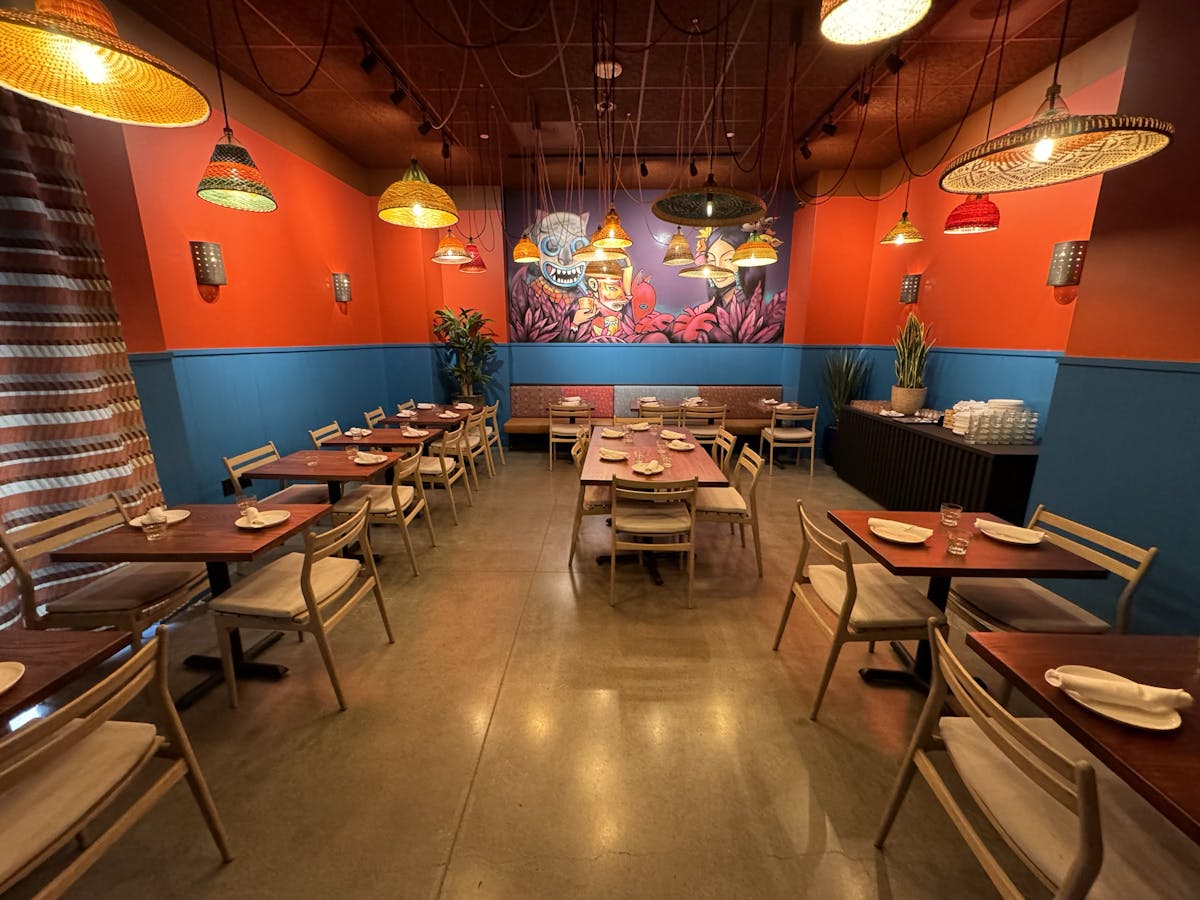 a room filled with furniture and a table in a restaurant