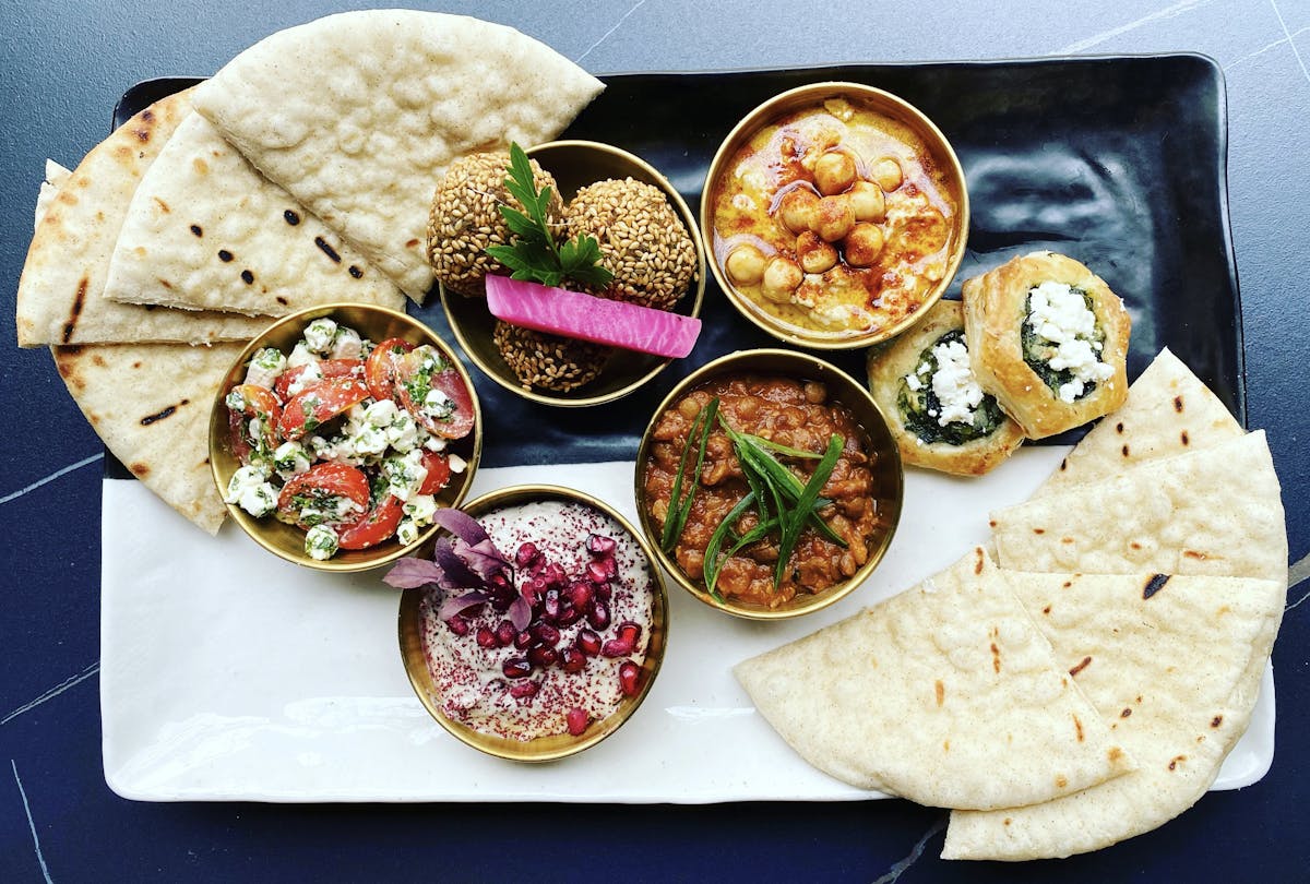 a box filled with different types of food on a plate