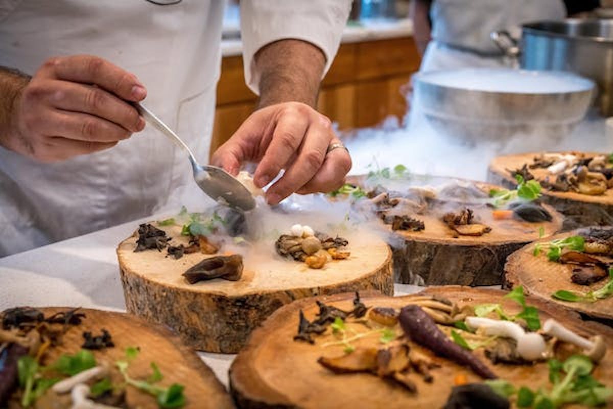 a person cutting food on a table