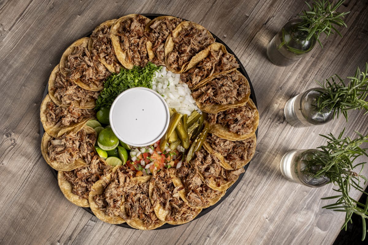 a pizza sitting on top of a wooden cutting board