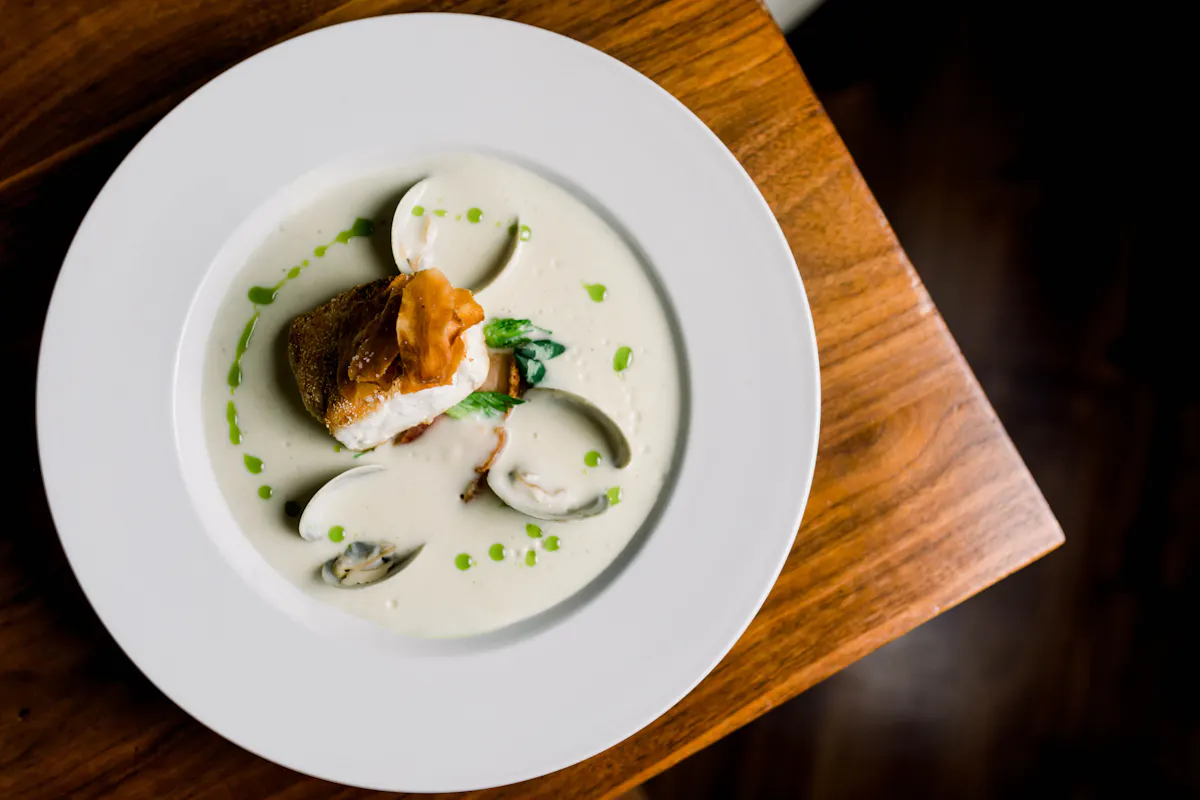 a plate of food sitting on top of a wooden table