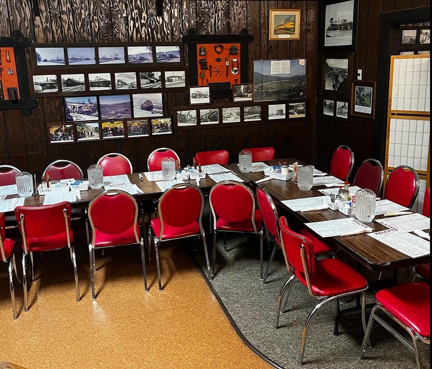 a group of people sitting at a table in a restaurant