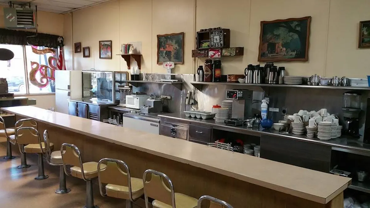 a kitchen filled with lots of counter space and a sink