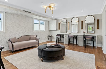 a living room filled with furniture and a large window