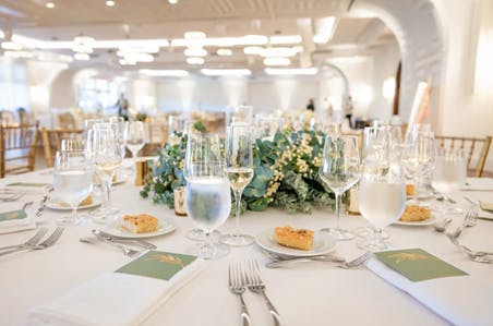 a group of people sitting at a table with wine glasses
