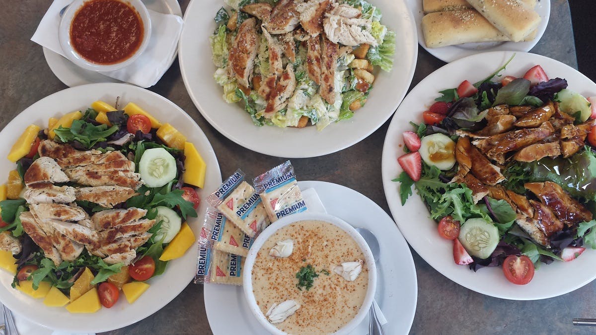 a bowl filled with different types of food on a plate