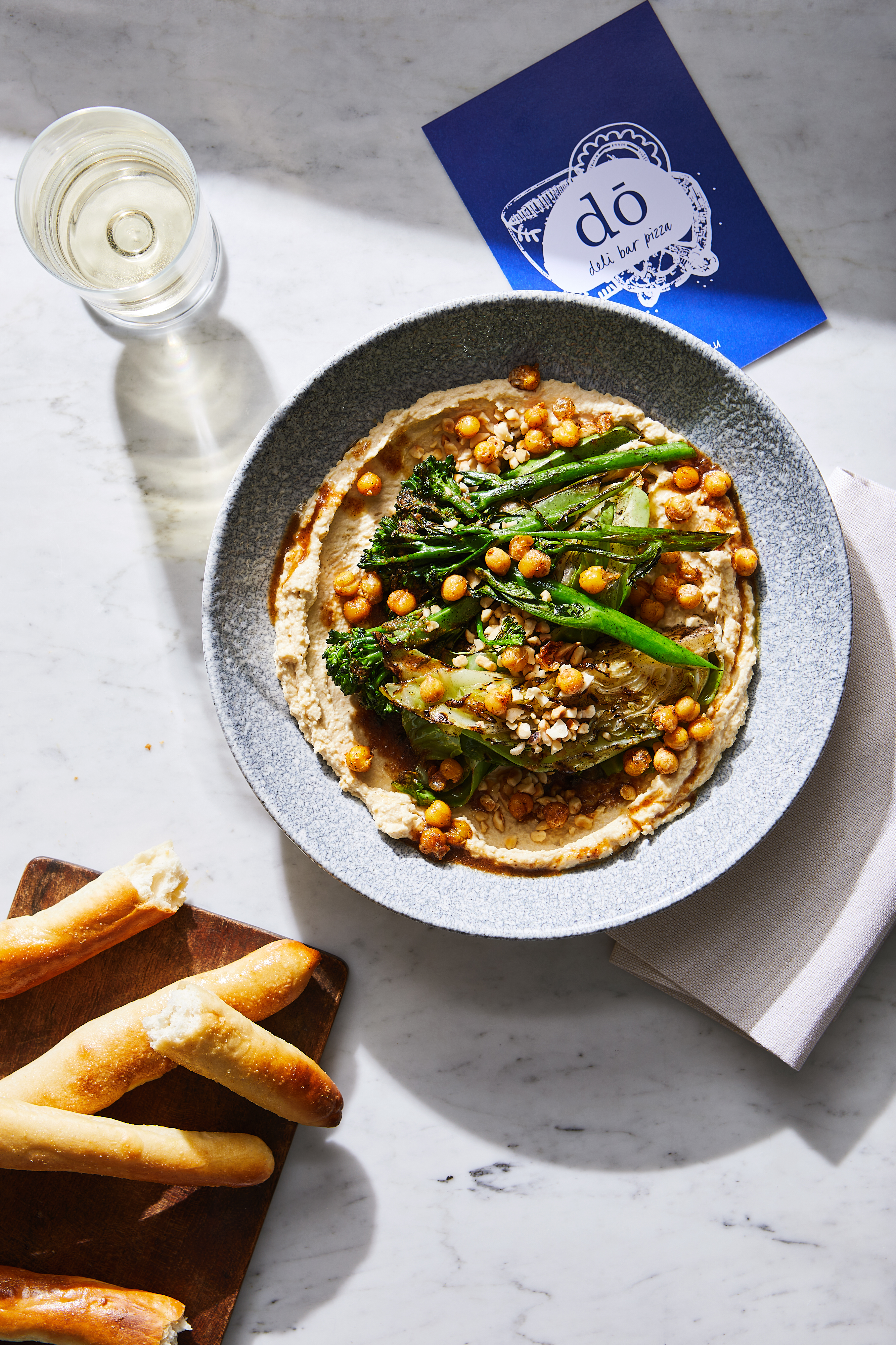 A plate featuring an assortment of fresh vegetables alongside slices of bread, beautifully arranged for a nutritious meal
