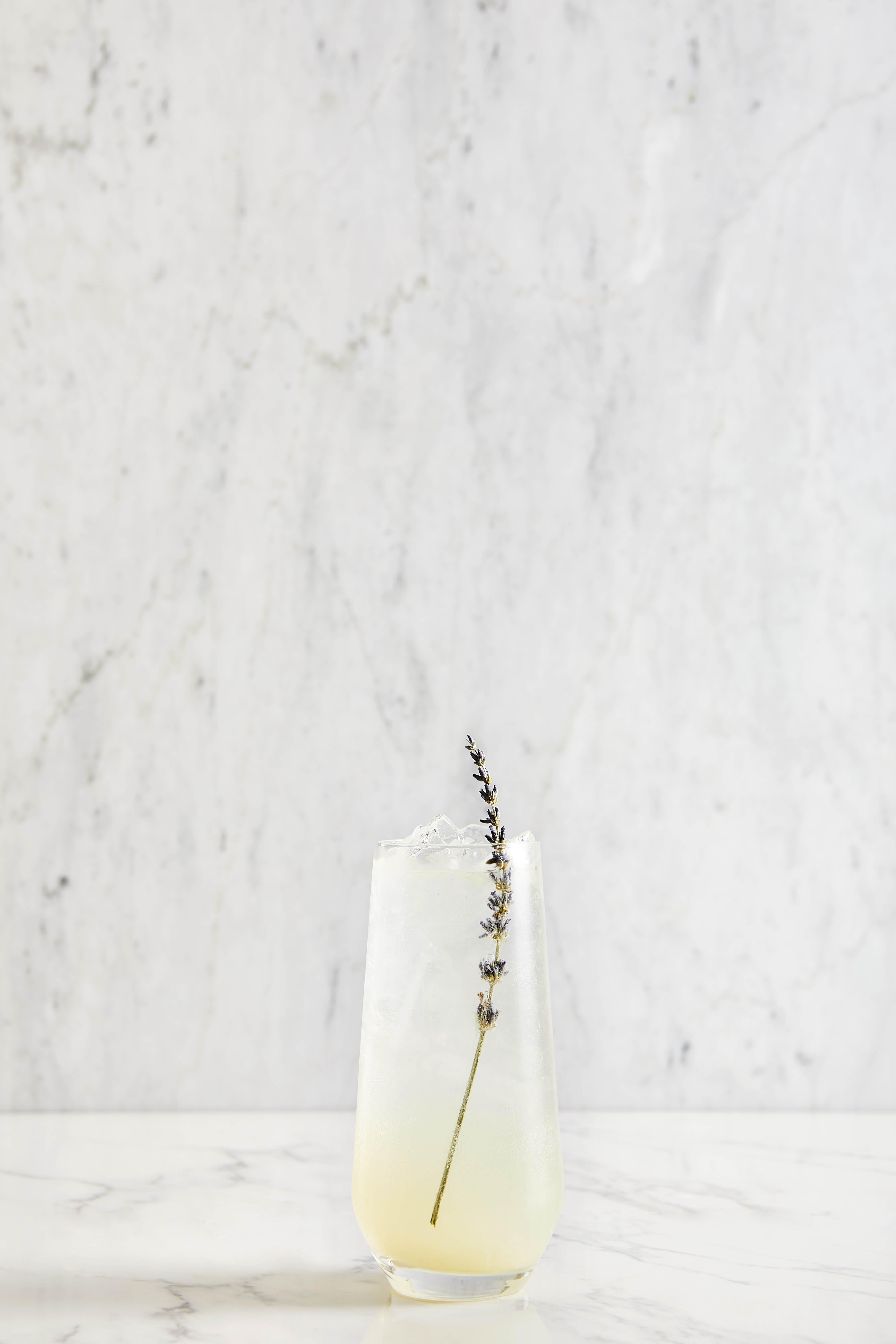 glass of lemonade with a lavender stick