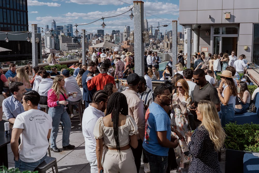 a group of people walking down the street in front of a crowd