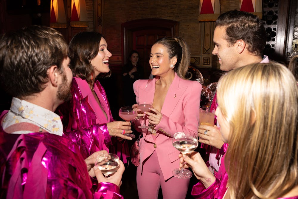 Eliana Lauder et al. are drinking from a wine glass