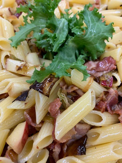 a dish is filled with pasta and vegetables