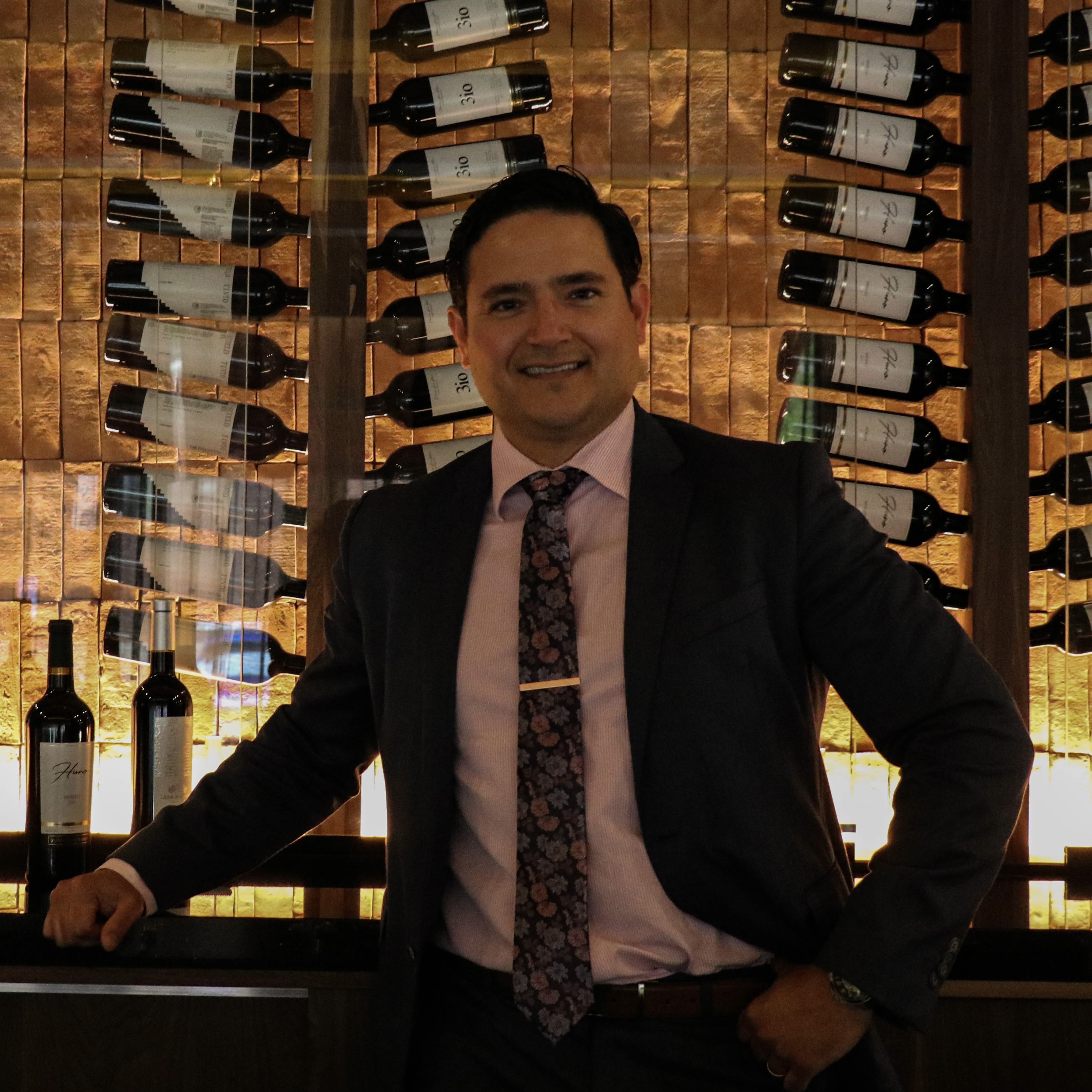 a man in a suit standing in front of a store