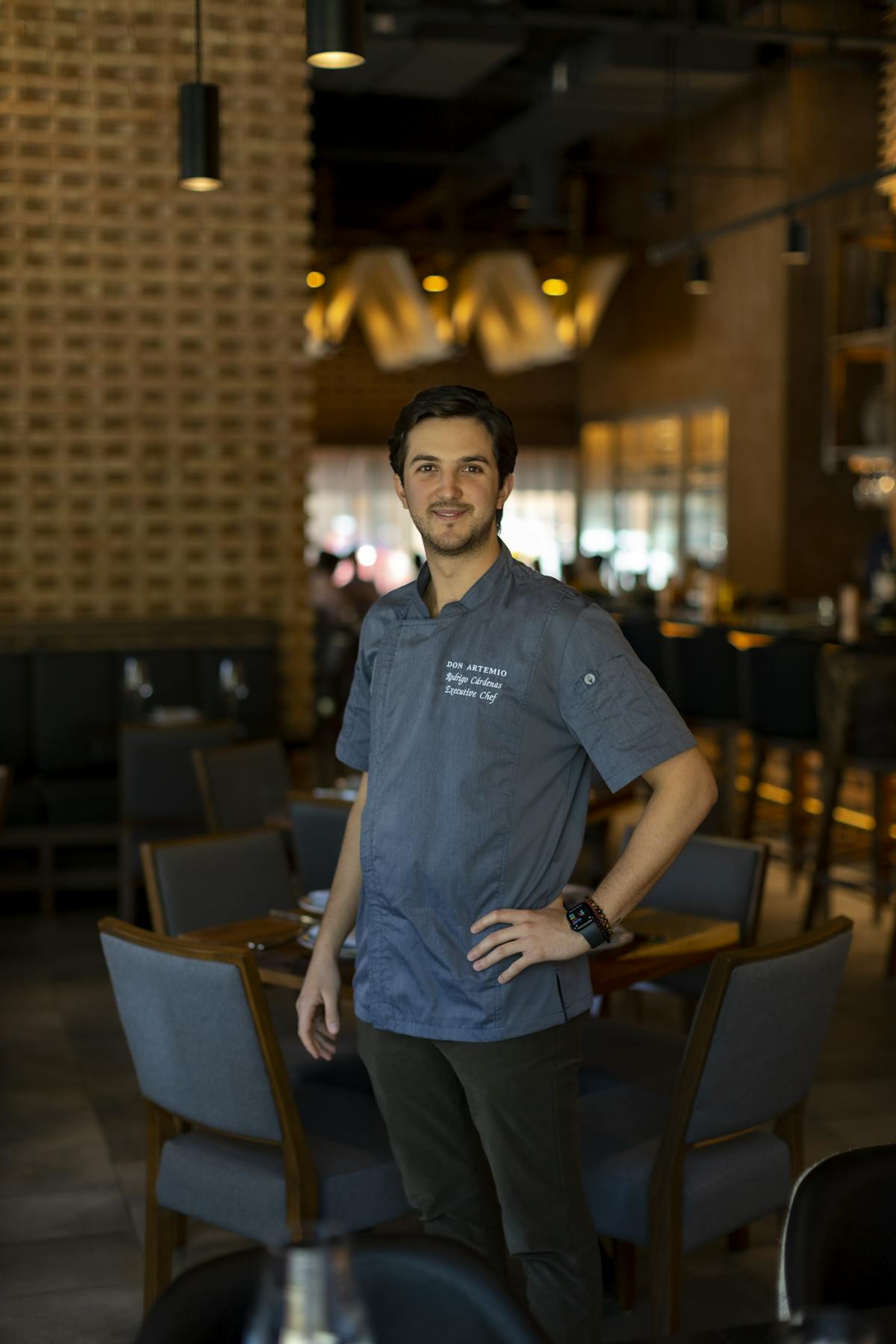 a person standing in front of a restaurant
