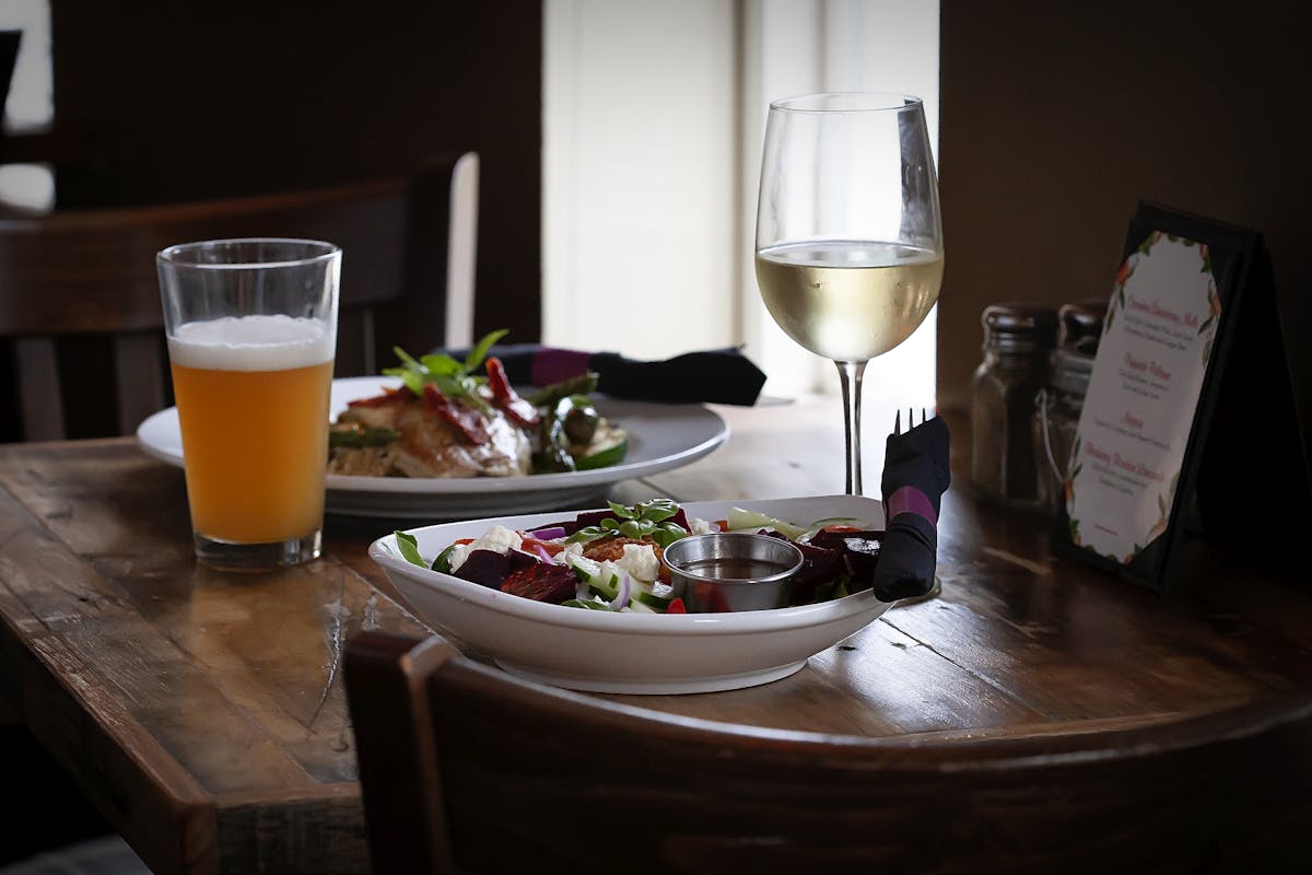 a plate of food and a glass on a table